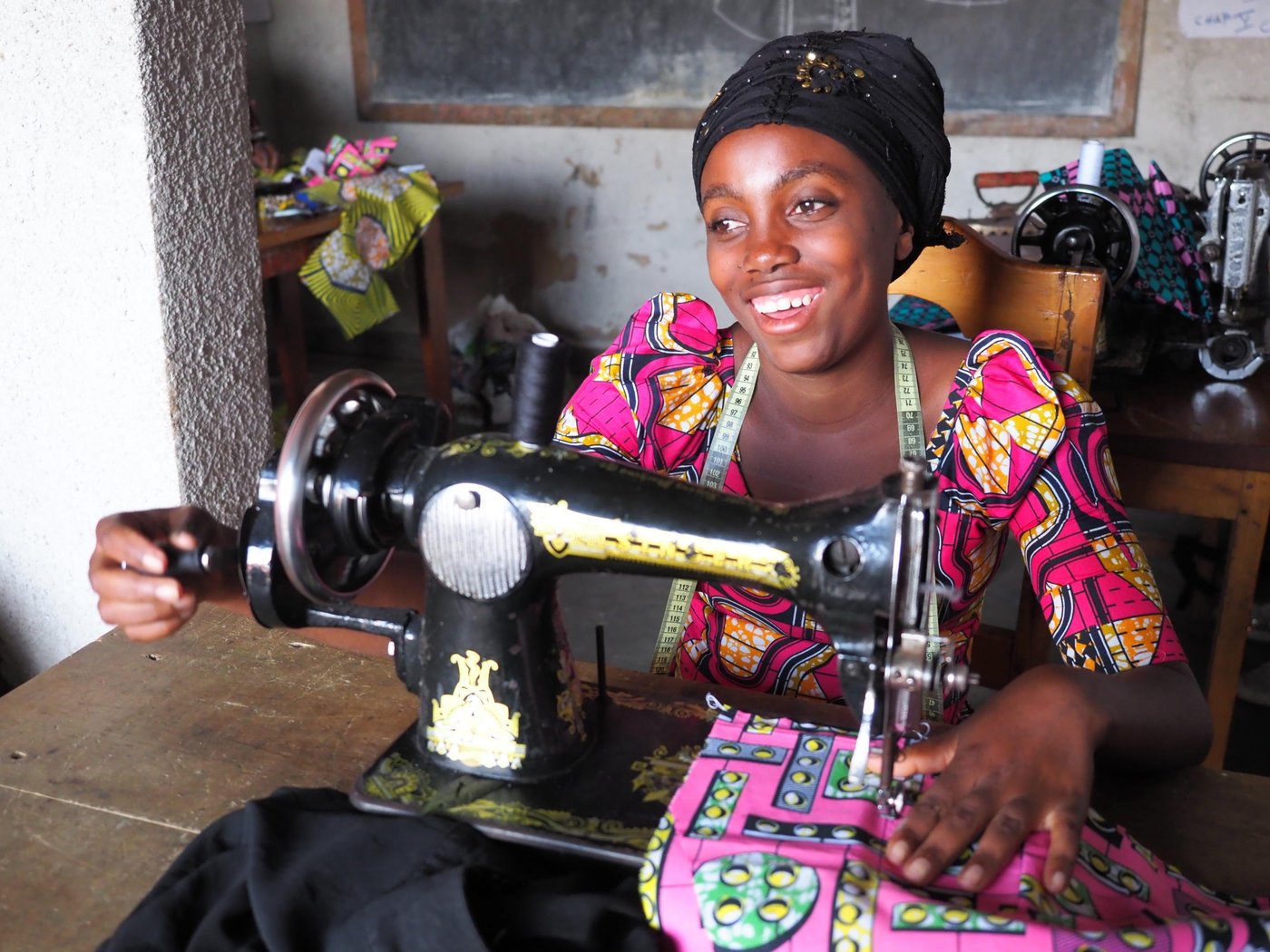 Rachel is twenty-years-old and lives with her parents, siblings and her 2-year-old daughter (name: Guylaine). She became pregnant when she was 17 with a boy from her village, but he disappeared when he revealed that she was expecting his child. Since August 2018, Rachel has been attending the NRC tailoring class in Kitchanga. These courses will last six months. After training, her dream is to start her own tailoring shop and to be able to give her daughter an education to in the future. She loves tailoring and she has made dresses for herself and her daughter. Before she was selected for the NRC tailoring class, she had nothing to do and now she is very happy to be able to attend the classes.
 
Rachel is from the village Ngingwe, Masisi territory, which is six kilometers from Kitchanga in the North Kivu province. She and her family had to flee during the night four years ago when the clashes broke out between armed groups. They travelled the whole night and reached Kitchanga in the morning. Rachel was very afraid when she had to flee and during this violence where she lost her grandmother and uncle. She misses them a lot. Rachel is still constantly afraid, and does not want to go back home until it’s safe. Since the attack, some people from the village have been back home to pick up food and their belongings, but they cannot sleep there, as the situation is still unsafe. Rachel has not been back home in Ngingwe since she and her family fled their home.
 
Rachel does not feel safe in Kitchanga either. She is scared that armed groups will enter Kitchanga and take over the town in the future. She does not feel well about being a displaced youth in Kitchanga. It is a big challenge for her because she is sometimes neglected. Since she also a single mother, people austersize her. 
 
There’s also a lack of food in Kitchanga, and Rachel does not have enough money to pay school fees, therefore she dropped out of school after second grade in secondary school. Rachel also struggles to pay for health care and clothes for her daughter. After tailoring class, she usually helps her mother to do some household activities, for instance, fetching water and cooking dinner. 
 
 Photo: Ingrid Prestetun/NRC