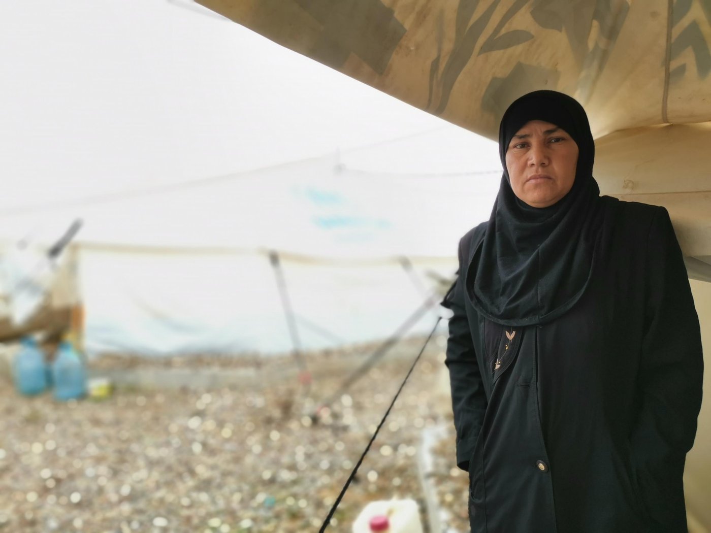 Kutayba – Displaced since 2018
“My husband, who owned the family property, was killed during the retaking of Mosul in 2018. He bought the house from his father without a contract. Now I cannot even prove that it belongs to us,” says Kutayba, 39, who fled from Nimrud district in Mosul and has been living in a displacement camp since 2018.
“Even if the house was registered under my name, it would not change my situation. The tribal leaders have the ultimate power in our area,” she says.
She says she fears for her younger sons after losing three already.
“There is nothing to return back to. My tribe will never let me go back.”
Photo: Helen Baker/NRC
