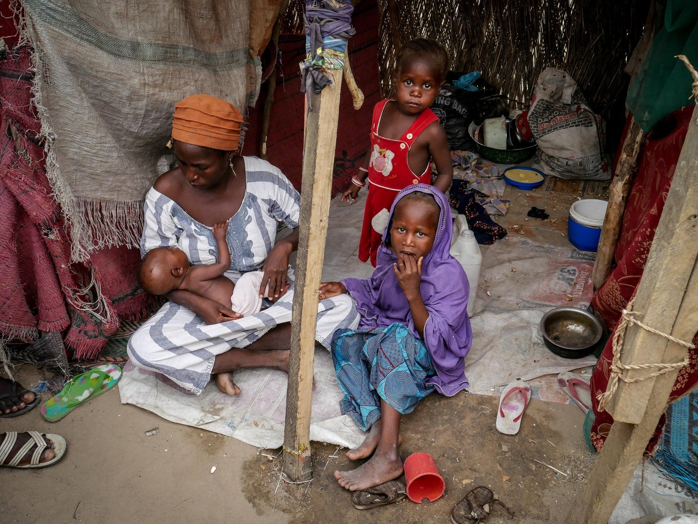 Suweba is 35 years old. Thirteen days after fleeing her hometown with her four children, she gave birth to a baby girl. Her husband remained behind when insurgents entered her hometown to ask them to leave. Since then, she hasn’t spoken to her husband and doesn’t know whether he is alive or dead.


“He said that he will join us. He hasn’t come yet. I am here alone with 5 children. We eat only once a day. I already ate this morning and I am not sure about tonight. Right now, two of my children are out begging to hopefully buy some food. I breastfeed my baby but I myself have not enough to eat.”
.
Credit: Hajer Naili/NRC