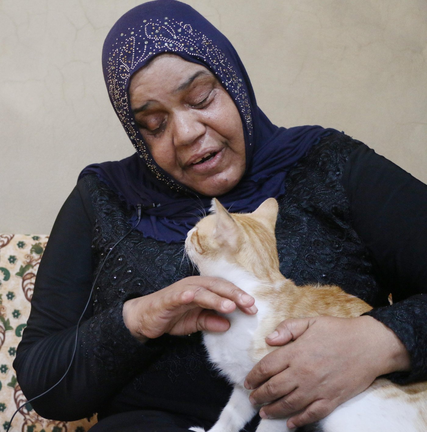 Nawal, 56, a Palestinian Refugee from Syria who lives in Lebanon.
Cat name: Antar
I raised “Antar” since he was a kitten, his mom gave birth to him in this building where I Live, now he Is two years old.
Whenever I go in the neighborhood, he follows me, but whenever he sees kids he hides from them.
He eats whatever we cook, but he doesn’t like food with tomatoes. The neighbors here like him, and get him food as well.
He likes playing with me, and he jumps on me. Once he got sick, I felt so worried about him, I asked my nephew to take him to the vet. Two days later he got better.
I got used to him, I am very attached him. I always ask about him. Some people complain that I raise a cat at home, saying that it is a dirty animal and will transfer diseases for me, but I don’t listen to them.
If I go back to Syria, I will leave him with my friend to take care of him.
I don’t want to take the risk, they might catch him on the checkpoint.
I will always remember him, and God will put other good people on his way to take care of him.
Photo: Nadine Malli/NRC