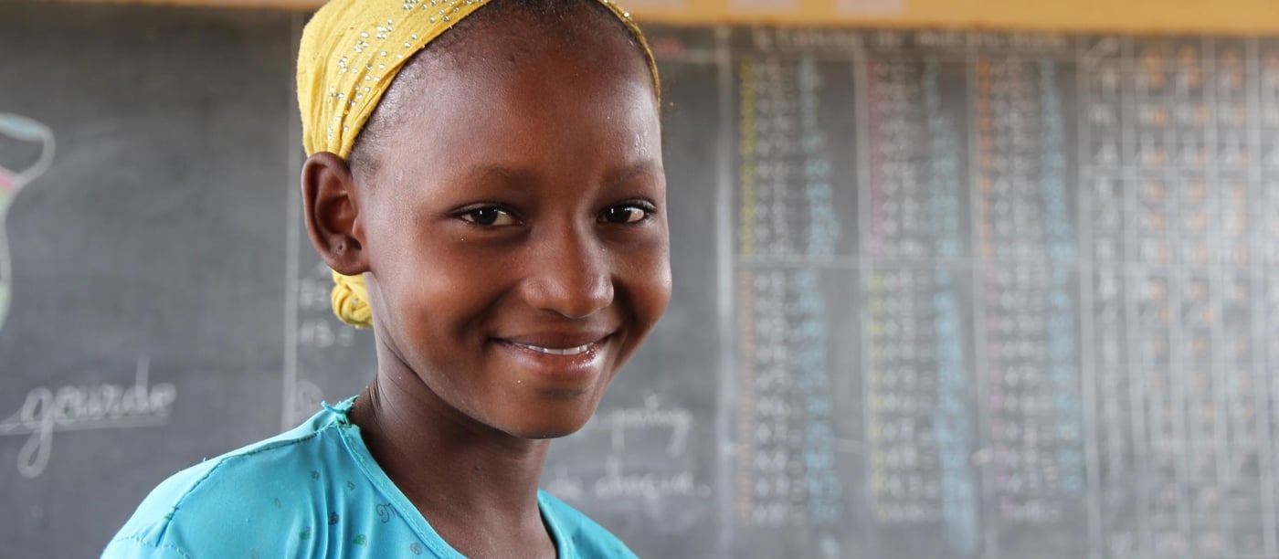 Sagda Wallette Abvadine is 9 years old (yellow and blue), and is attending second grade at the school in Goudebo refugee camp. She has lived in the Goudeb refugee camp for two years. Her favorite subjects are mathematics and reading, and she is very fond of drawing. Sagda is in the same class as her 8 years old sister Zeinabou Haïdara (in black). They go in the same class because the classes are divided after the children`s knowledge level and not by age. Many of the children have never been to school before they came to the Goudebo refugee camp in Burkina Faso.

Education:

NRC has through the years provided different types of education programs. In 2013-2015 NRC ran an education project in the Mentao refugee camp comprising a catch-up programme for children of school going age who have been forced to drop out of school. NRC also had  a YEP program (combining literacy educational and learning crafts) for youths between the ages of 15 to 24 who can no longer make in into the normal school system. 163 pupils completed the catch-up programme while 105 youths completed the YEP programme   

Now NRC is providing education for smaller children in the Goudebo camp; Ecole Primaire de Goudebo has between 800 and 900 pupils aged from 6 to 12 years, divided in six grades. The number of pupils differs with families trying to return to their country of origin. Return programme is facilitated by UNHCR.

Most of the pupils are refugees, but the school also has some pupils from the host community.

There are 6 grades at the school. In the first two years (CP 1 and CP 2), there are two teachers in each class. Because the school language is French, and many of the refugee children do only speak local Tuareg dialects, they need help for translation to be able to follow the education. (Official schools in Mali is also teaching in French)

NRC target that 50% of all pupils should be girls is met in the vast majority of the classrooms. The age of the children in each class differs. Most of the children arriving in the camp have never gone to school before, so they have to start in the basic class regardless of their age. 

Most of the pupils have books to write in, but in a few classes the pupils still uses small wooden boards and chalk.

Photo: NRC/Ingrid Prestetun