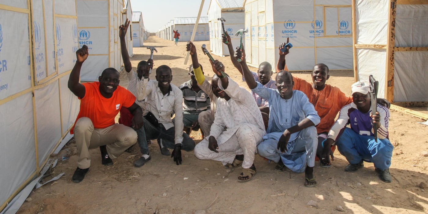 Carpenters doing the Construction of Temporary shelters for NRC in Bakasi camp together with Bulama-shelter assistant NRC Maiduguri (1st left).
Photo: NRC/Ingrid Prestetun