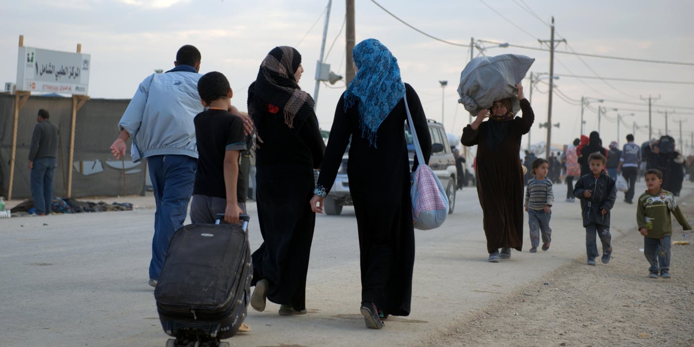 Syrian Refugees walking towards the Zaatari camp in Jordan.