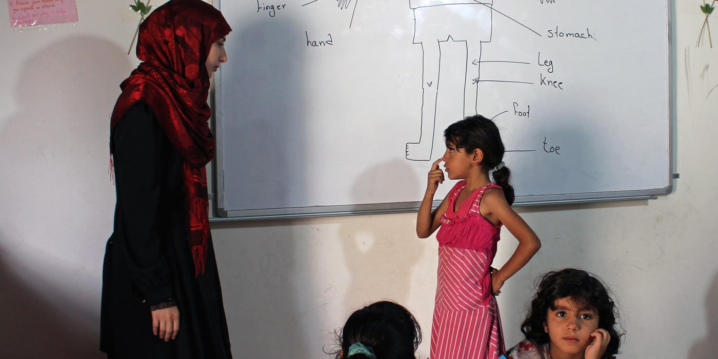 Rama (7), a refugee from Aleppo, Syria, recites her English lesson to Lebanese teacher Aya (28), at a makeshift school set up by the Norwegian Refugee Council at a gathering in South Lebanon.
Photo: NRC/Rayane Abou Jaoude