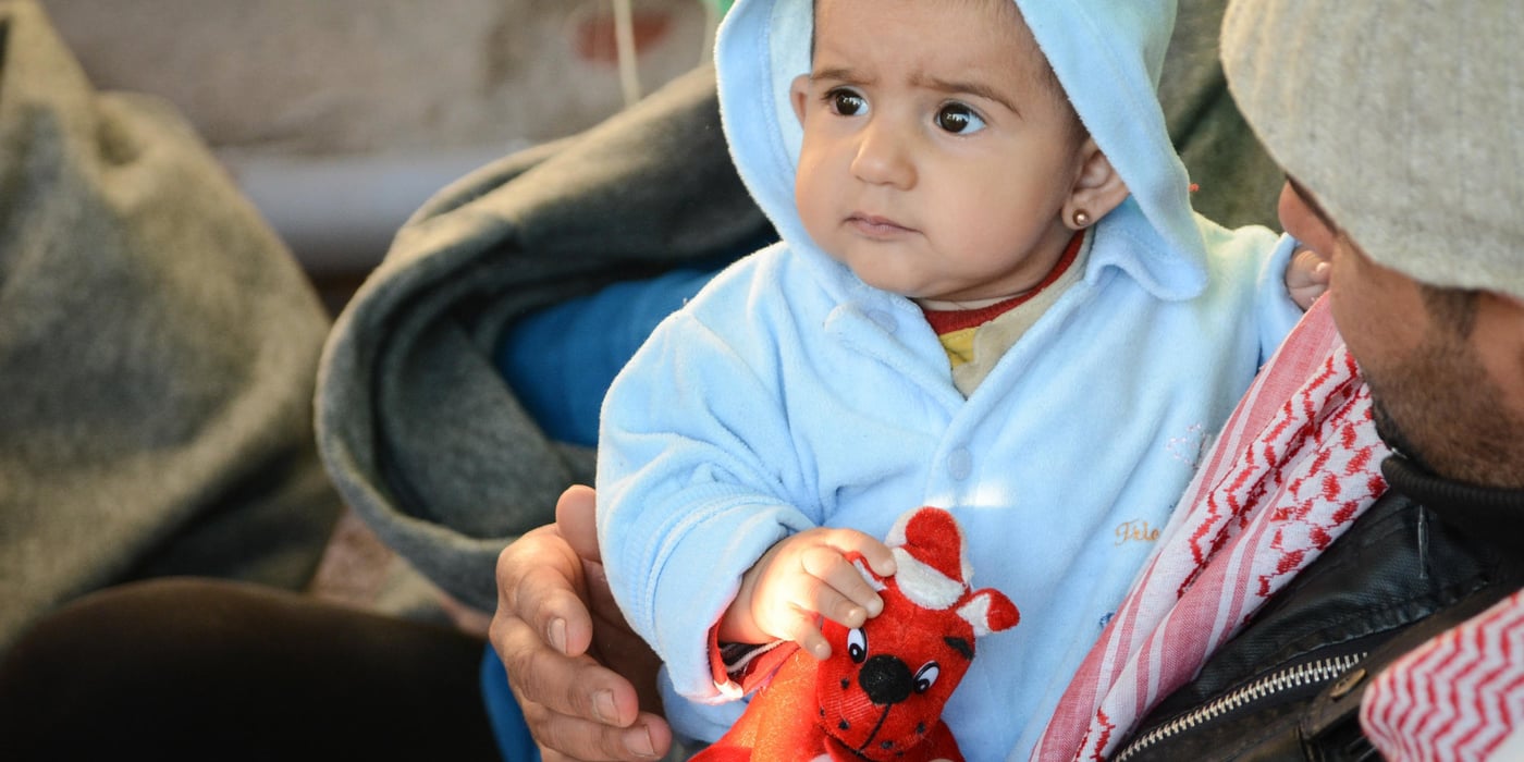 Syrian Shara (6 months) is wrapped into some new dry clothes, after arriving Chios island in Greece tonight. NRC is working together with greek volunteers to distribute warm clothes to the children. Photo: Tiril Skarstein, NRC
More than 700 people arrived to the shore at Chios, Greece during the night 4.11. NRC was meeting some of the refugees at the beach and taking them to the registration place at the port - where the newly arrivals were gathered. About 400 people slept side by side in a big rub hall - while others had to sleep outside, due to a lack of capacity. NRC handed out blankets, food and water and cooperated with greek volunteers who helped distribute warm clothes to the children and people who were soaking wet from the rough sea.
Photo: Tiril Skarstein, NRC