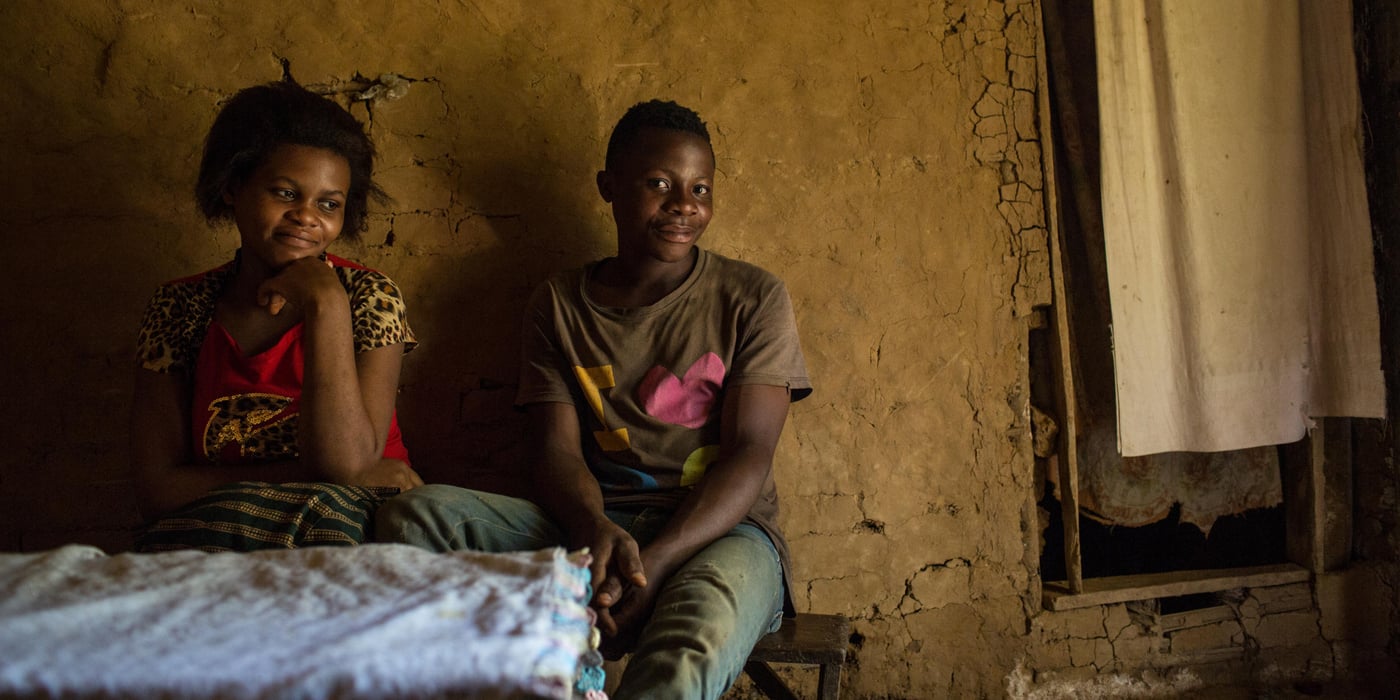 15 year-old Lucie was displaced in early 2015 when fighting broke out in her village. After arriving in Pinga village, her family married her to a 15-year old boy because they were no longer able to provide to her. Lucie is now pregnant, and participates in activities at one of the Temporary Learning Spaces (TLS) organized by NRC. Her husband Veiko also plays football regularly at the same TLS.
Child marriage is widespread in Pinga, and NRC has worked with community leaders to spread the message of children's right to education and the community leaders have spoken out against child marriage in community meetings and church gatherings. Many people were unaware that child marriage is illegal.
PROJECT INFORMATION: Children of 16 vulnerable schools affected by the armed conflict in Pinga/North Kivu are supported by The Norwegian Refugee Council funded by a grant from the European Union’s Nobel Peace prize: Children of Peace initiative. NRC supports children by providing them access to quality education and giving them the opportunity to learn in safe, protective and nurturing spaces. In doing so, NRC contributes to reducing the suffering and vulnerability of conflict-affected children.
Photo: NRC/Vincent Tremeau
Pinga, le 1er mai 2015.
Lucie vit avec Veiko. Ils ont 15 ans tous les deux.
Photo: NRC/Vincent Tremeau