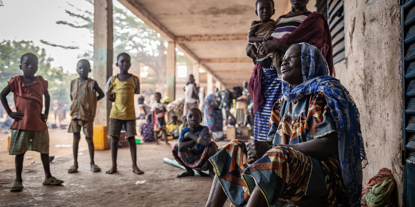 On 7 July, men armed with Kalashnikovs burst into the village of Nogo. The attack lasted 60 minutes, mainly targeting an outpost of a self-defence group, the VDP. At least 7 civilians, including 2 women and a baby, were killed in the shootout. The assailants took advantage of the situation to steal pharmaceutical products, two health workers' motorbikes and livestock belonging to the civilians.
The entire population of the village fled to Ouahigouya and took refuge in an unoccupied school during the school holidays. More than 500 people are living crammed into classrooms while waiting to receive shelter and adequate aid. However, the aid received is far from sufficient. The displaced report receiving a bag of millet on arrival, then nothing. They survive thanks to the help of the local population. Some are tempted to return home to collect their cereal stock despite the presence of armed groups.
"We fled to come here but there is no food. We are thinking of going home, but we are very afraid of being killed, so we are staying for now. If we get help here, we can stay, it will be better," says Rouamba, a mother from Nogo village.
Date: 25 August 2021
Location: Ouahigouya, North province, Burkina Faso
Photo: Tom Peyre-Costa /NRC