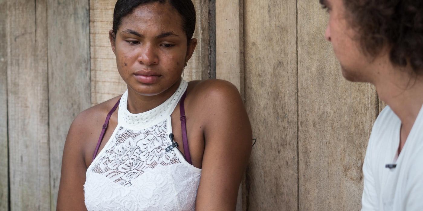 Jhoana tells her story to Marlon Langeland.
Jhoana, 20 years old, and her family had to flee after an armed attack in her village. Two of her brothers and her two cousins where killed. All male youth.
Jhoana grew up in a small village along the river in the region of Chocó, Colombia. She loved playing with her siblings and cousins, walking in the bush and went swimming. Her dream was to study veterinarian because her passion for animals. Her dream got tossed when the community repetitively was threatened and they eventually had to flee.
Armed attack
It was an ordinary day in March 2017 when Jhoana and other women were celebrating women’s day. The remaining village, mostly males, continued their normal activities when all of a sudden an armed group attacked. That night Jhoana couldn’t sleep due to nightmares and not knowing the extent of the attack and not being able to go back to the village before the next day.
The next day they witnessed several dead and wounded youths and she was devastated. Not one, but two of her elderly brothers had lost their lives. One where tied up and the other one was laying dead on a rooftop with rain poring down on the body. Furthermore, two cousins and a family friend, all young, and all males also lost their life’s.
Today, the village is abandon and appears more like a ghost town. Jhoana and her family are now too afraid to return to their village because of the uncertainty that follows and if another armed attack will happen again.
Life today
Now, her daily activities are restricted to short trips; when she leaves the house, she does not go far and she coordinates her trips with relatives. A common daily activity can consist of meeting her cousins at the pier and watch them swim. Or, she will only hang out in their house. At home, where she spends most of her time, she writes her diary to cope with the armed attack and the loss of her two older brothers. She also does her homework in secondary school, or, she helps her mom with cooking and takes care of her 12-year-old niece, Yurani, that lost her dad in the armed attack. She now feels that she has to support her family because her parents are old and the two oldest brothers are gone.
She continuously strives to stay positive and cope with the armed attack. “With the heart broken I have to be brave. Forget bad things and bring positive things. Even with this pain, I want to get ahead. I have to fight for positive things to happen”.
Hopes for the future
The only way she can fulfil her dream and help her family is to leave the village and continue studying, but there is no money to study for. “I now have a 12-year old niece and I would like to be a good example for her. My nieces father was killed in the armed attack and her mother died due to illness prior. Thus, if I go on to study and build my life I will then get a good job and she will hopefully acquire strength to achieve the same”.
Jhoana is hoping for peace in Colombia, but she is not sure if that will happen. She has realized that there is no future in the village she is displaced and the road is unfortunately short for youth to armed groups and drugs. Thus, she believes the path lies in education and underline the importance to reach a common agreement in peace in order to progress the country.
Message to youth
“If you want something you can achieve it, therefore you should proceed it”. “Even if someone hurts you, you have to be strong and get ahead”. She continues, “while you are alive you have to be brave, even if you smile outside and cry inside we should proceed with our dreams”.
“Don’t believe in negative things, don’t fall into bad vicious, be ambitious in a positive matter, and fight for the future and don’t be defeated”.
Photo: Beate Simarud/NRC
NRC in Colombia
- NRC has been present in Colombia since 1991.
- NRC currently counts on 19 field offices in order to provide assistance to internally displaced and Colombians seeking international protection in the neighbouring countries.
- About 100.000 people benefited in 2017 from NRC´s programs (information, counselling and legal assistance (ICLA), education, regional refugee program and the roving capacity unit). Budget forecast 2017: 97.6 million NOK
- Strategic priority for 2018 continues to be to address displacement and emergency related protection gaps and humanitarian need when the state is unable or unwilling to fulfil its obligations. The peace accord will increase the likelihood that durable solutions can be sought with more vigour. NRC will in this context increase efforts to contribute to durable solutions, both in Colombia and in neighbouring countries.
Key facts
• Humanitarian and protection challenges continue in Colombia. A six decade-long armed conflict has given Colombia the most prolonged and serious humanitarian crisis in the Americas. In total, more than 7.4 million people are forcibly displaced in Colombia by the conflict.
• Since the signing of a peace agreement between FARC-EP and the government in November 2016, about 200,000 people have been displaced (nov 2016 – august 2018) – the equivalent of one person every 5 minutes. Rights defenders, indigenous and Afro- Colombian leaders, and other community activists face threats, killings and violence. Perpetrators are rarely held accountable.
• There are more than 191,622 Colombians refugees and in need of international protection in neighbouring Ecuador, Panamá and Venezuela, according to UNCHR.
• Forced displacement increased in 2018. During the first semester group displacement increased 112 % in comparison with the previous year (2017).
• During 2018, there was an increase (31 %) in the number of attacks against the civilian population, compared with 2017. Threats continue to be the primary mean of attack against the civilian population, although there was a growth in the number of homicides and intentional injuries targeting persons who were under state protection schemes.
• 9 in 10 people displaced by Colombia's civil war have not yet received compensation promised for crimes committed against them. Over 8,7 million Colombians are registered with the Government’s National Unit for Victims. However, only one out three applications for compensation by the 2011 Victim’s Law in Colombia has been approved. Despite GOC efforts allocating important resources ensure the implementation of the law, the efforts needs to be increased.
• During 2018, 77 % of the people recorded in massive displacement events belongs to farmers, 11 % indigenous and 11 % afro Colombian communities.
• The peace agreement between FARC-EP and the Colombian government is a positive development, but the dynamics of armed conflict and other forms of violence are in flux. Other irregular armed groups have increased their actions in the shadow of the ceasefire, and the clash with these groups is causing the majority of new humanitarian needs.
• NRC recorded 22 events that affected the continuity of thousands of children attending classes during the first trimester of 2018. 7 IHL serious violations against schools have been reported in the first semester of 2018 and forced recruitment into armed groups appear to increase this year.
• Of the total resources requested (156.5 Millions) by the Country Humanitarian Team, only 22 % has been financed (OCHA July 2018)