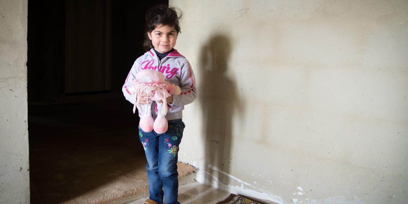 Syrian refugee Ilham (4) stands inside a NRC rehabilitated shelter in Tyre, south Lebanon.

Her father Mohammad (35) is disabled and has been unable to find work in Lebanon. She was born on March 15, 2011, and her family fled Damascus to Lebanon eight months later.

Photo: NRC/Tiril Skarstein
