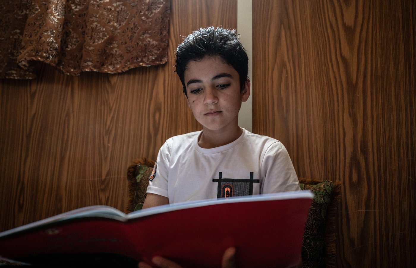 Photo: Daniel Wheeler/NRC
Details: 12-year-old Shaher is originally from Dara'a, Syria. He has lived in Za'atari Refugee Camp since fleeing the war in Syria in 2013. He lives with his mother, father and two younger brothers.
"I am scared of the virus. I feel stressed all the time and it makes my head hurt. We are trapped in a prison with the virus."
"There's rumours around the camp that if there's an outbreak, we won't survive."
When asked what he believes will happen if he becomes infected, Shaher replies: “Maybe life. Maybe death.”