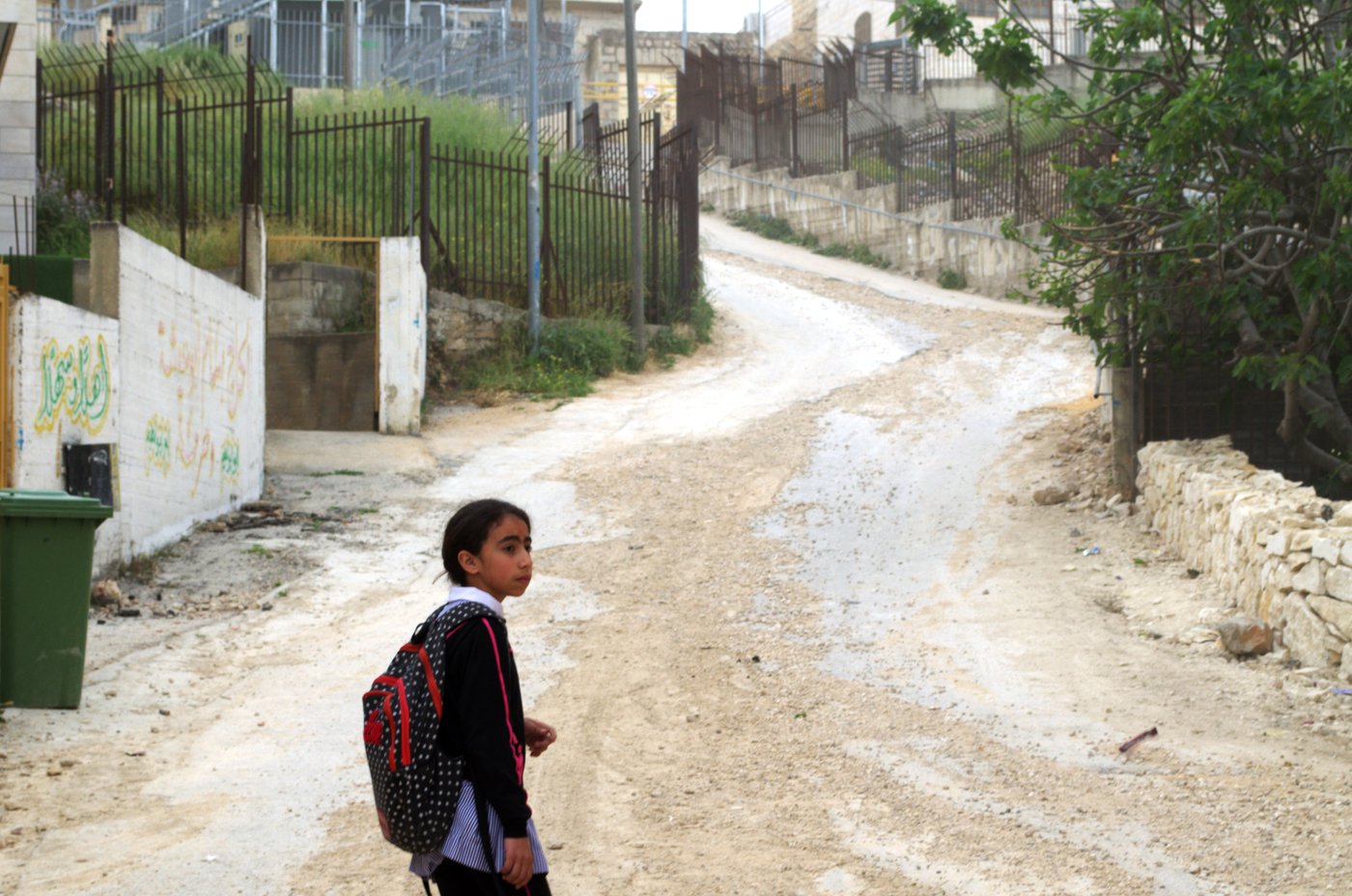 Muna's friend, Doa'a, 11, has to cross two checkpoints and take an enclosed pathway as a shortcut to school in Hebron's Tel Rumeida neighborhood.
Photo: Ivan Karakashian/NRC