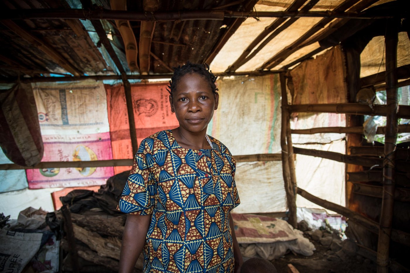 Minette (38) and her family fled from Manyu and sought safety in Buea after their home was burned down. They have received some plastic sheeting and utensils from NRC, and they have built a temporary kitchen at their new place in Buea.

Photo: NRC/Tiril Skarstein