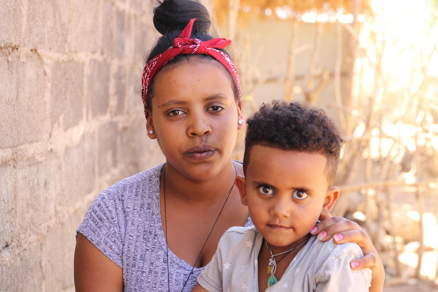 Eden didn’t tell her parents she was fleeing Eritrea and leaving them. She has dreams of reaching Europe and being reunited with her brother in Germany, but he doesn’t want his little sister to take the dangerous journey.
 "I had to leave Eritrea. Life there is really hard."

We first meet the twenty-year-old in a refugee camp in northern Ethiopia. It’s dry season, and the temperature is rising quickly during the morning hours, reaching almost 40 degrees. The ground is dusty and the trees don’t have enough green leaves to protect us from the sun.

Eden greets us outside the bright turquoise-painted house as we arrive, asking us to come inside. "I’ve lived here for a little more than a year now," she says.

She didn’t plan to stay that long.

"I want to go to Sudan, then Libya and further on to Europe," she explains. And yes, she is aware that it is a dangerous journey. She has friends who have taken the same route, some of whom made it to Europe. Others didn’t complete the journey.

Keeping her parents in the dark
In 2017, more than 25,000 Eritreans fled across the southern border of their country to Ethiopia. Most of them are youth and minors, and many fled alone. Most cite Eritrea’s mandatory national service, which is compulsory for citizens from the age of 18, as the main reason for leaving the country.

Four years ago, Eden’s 27-year-old brother made it to Germany. He took the long, dangerous journey through Sudan and Libya and across the sea to Europe. In November 2016, Eden decided to do the same. She said nothing to her family.

"If I had told them, I’m certain they would have stopped me."

First, she went to her grandfather’s place to hide from the military. While she was there, she asked her aunt to send her some money, which she then paid to a smuggler. On the day she left, she saw her father in the street. She managed to hide from him.

"I regret that I didn’t have the chance to say goodbye to him," she says, tears in her eyes. It was not an easy decision to leave her mother, father and siblings, but Eden felt she had no other choice.

As I see it, I have two options in life: to succeed or to fail. I have heard it’s very difficult, but as long as going through Sudan and Libya is the only way to reach Europe, that’s what I want to do."
Eden, 20.
Hid from the military
Along with a group of 16 others, she embarked on the journey from Asmara, the Eritrean capital. They walked for five days before the military showed up and started shooting, forcing them to hide for two days with no food or water. The entire time, Eden was afraid they would get caught. She knew there are penalties for evading or deserting the service. In the end, they decided to go back to Asmara. There, the smuggler called, urging them to continue the journey. Eden, along with four others from the original group, decided to try a second time, and about a week later, they arrived at the Ethiopian border.

"I miss my family. They didn’t support my wish to leave and my aunt considers me a thief. The only family I have now are the girls I stay with."

In the camp, Eden shares a small house with five young women her age. They didn’t know each other before they arrived but have become good friends. All of them left their families and fled their home country in similar fashion. Eden has not been in touch with her parents since she left, but when the internet works, she chats with her sister on Facebook. Earlier this week, she called her brother in Germany.

"He doesn’t want me to leave for Europe and keeps telling me to stay in the camp because there will be opportunities for me in Ethiopia."

Will either fail or succeed
Eden has made up her mind.

"As I see it, I have two options in life: to succeed or to fail. I have heard it’s very difficult, but as long as going through Sudan and Libya is the only way to reach Europe, that’s what I want to do."

Facts
Eden is not alone. Most of the Eritrean refugees leave the camps within the first year of their arrival. Many attempt the journey to Europe, often with assistance of smugglers and at great risk to their lives.

"The only reason I’m still here is that it has become more difficult to go. My plan is to go, and I will take the same route as everybody else. I don’t know when. It could be tomorrow, the day after, in a month or a year, but as soon as the sea-border is open, I will go."

Big plans
Eden spends her time in the camp planning for the future. Along with her roommate Winta, 23, she goes to cooking classes at the Norwegian Refugee Council’s (NRC) youth education centre in the camp.

"I am very happy that I have not wasted my year in the camp. Unlike others, who just sit around doing nothing, I have studied and worked hard," she says with a smile.

The next day, she will sit the cooking exam that will give her the Ethiopian government’s official certificate. She is not nervous.

“I am feeling fine. I am well prepared, and our teachers have been very good, so I hope I will pass.”

On the day of her cooking exam, we meet her at the youth education centre. She is wearing her cooking clothes and hat and looks ready.

During the six-month course, she has learned how to cook various meals, make sauces and bake bread. She has followed lessons in proper kitchen hygiene, learned how to make the table and serve customers. On examination day, she is showing her skills to the examination proctor from the Ethiopian government.

An hour later, she has a big smile on her face. She passed the exam.

“I have got a lot of plans,” she says, serving us freshly made club sandwiches, potato bread and salad. “I would like to work in the restaurant of a big hotel, preferably in Europe. Then, with time, I want to open my own restaurant. I will call it Asmara.” Photo: Ingrid Prestetun/NRC