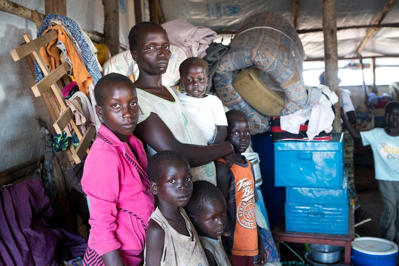 About 90 percent of all South Sudanese refugees in Uganda are women and children. Agnes Drabua (35) sits together with her five children in the newly opened settlement Pagirinya. As the majority of women here, she came alone with her children across the border.
“We are peaceful people. I only want peace and a safe future for my children,” says Drabua.
-------
Thousands fleeing to northern Uganda
The deadly fighting in South Sudan has created enormous challenges for neighbouring Uganda. From food shortage to water-borne diseases, the humanitarian needs are greater than ever before.
Text and photo: Sofi Lundin
“We ran for our lives to avoid being killed. I spent all the money I had to bring my children to safety in Uganda,” says Agnes Drabua (35). She is one among thousands of refugees who crossed the border into neighbouring Uganda last month.
According to the latest figures from the UN Refugee Agency (UNHCR), 69,215 South Sudanese refugees have crossed into Uganda since the recent fighting erupted on 7 July. That is more than twice the number of people who came during the year’s first six months. Reception centres can no longer cope with the extraordinary influx of refugees. Humanitarian organisations and the authori-ties are doing everything they can to meet the needs, but they lack resources.
“The large number of refugees has put enormous pressure on our resources. We do everything we can to assist, so that the aid reaches those in need, but it is extremely challenging. We do not have enough staff and the economic resources are too scarce to cover all the needs,” says Emmanuel Adowa who works at the NRC office in Adjumani.
Reducing food rations
The open square by the Nyumanzi reception centre is crowded. The reception centre, which is de-signed to accommodate around 2,000 refugees, is today home to more than 13,000 South Suda-nese refugees.
“The centre is overflowing and we can no longer provide enough food to people residing here. In August, we have been forced to reduce food distributions by half to those who are already resi-dents, in order to be able to help the new arrivals,” says Albert Alumbi, settlement coordinator at the government office in Nyumanzi.
Cholera outbreak
About 90 percent of all South Sudanese refugees in Uganda are women and children. Agnes Drabua (35) sits together with her five children in the newly opened settlement Pagirinya. As the majority of women here, she came alone with her children across the border.
“We are peaceful people. I only want peace and a safe future for my children,” says Drabua.
The Pagrinya settlement is only a few weeks old, but already home to over 27,000 people. A chol-era outbreak few days ago has put even greater pressure on resources in the area.
“At first, we identified two patients with cholera. Now, the figures have risen to 37 people and the cholera team in the area is working hard to stop it from spreading,” said Ahmed Rasul, health worker at the clinic in Pagrinya.
“We have been forced to establish strict procedures for hygiene. The big challenge is that the set-tlement is full. We are deploying people from here to the newest settlement in Yumbe, says Vincent Amaroma, settlement assistant at the government office in Pagrinya.
Food crisis
South Sudan is today one of the world's largest humanitarian crises. According to UNHCR, close to a million refugees have crossed the border into neighbouring Sudan, Uganda, Ethiopia and Kenya. Inside the country, nearly two million people are displaced. The refugees coming across the border tell of brutal killings, rebels burning down houses, and military stealing peoples’ money. At the border in Elegu, the last days have been less hectic, but the steady stream of refugees continues to pass. Although the conflicts in South Sudan have subsided since the battles broke out in early July, the situation is still tense.
“Yesterday, several police officers came across the border with their families. This says something about the security situation in the country. Now that the fighting has calmed down, one of the main reasons why people flee is food shortage. We still have room for more, but it will not last for long,” says Frida Kajoki, registration officer at Elegu.
Born a refugee
Alice Digama (24) is sitting on the tent floor with her two-week-old baby. Her son is one of many children born a refugee. The new-born is breathing heavily. It is blazing hot inside the tent. Digama was heavily pregnant when she escaped and crossed the border, after her husband left her for an-other wife. Now she dreams of a peaceful life and a secure future for her son.
“I'm so tired of the war. I cannot stand to be afraid anymore. Now, I think about my boy's future. I hope he will be fine,” says Digama.
While the number of refugees in South Sudan’s neighbouring country Uganda is increasing, the war continues to ravage the world's youngest country.
Text og photo: NRC/Sofi Lundin