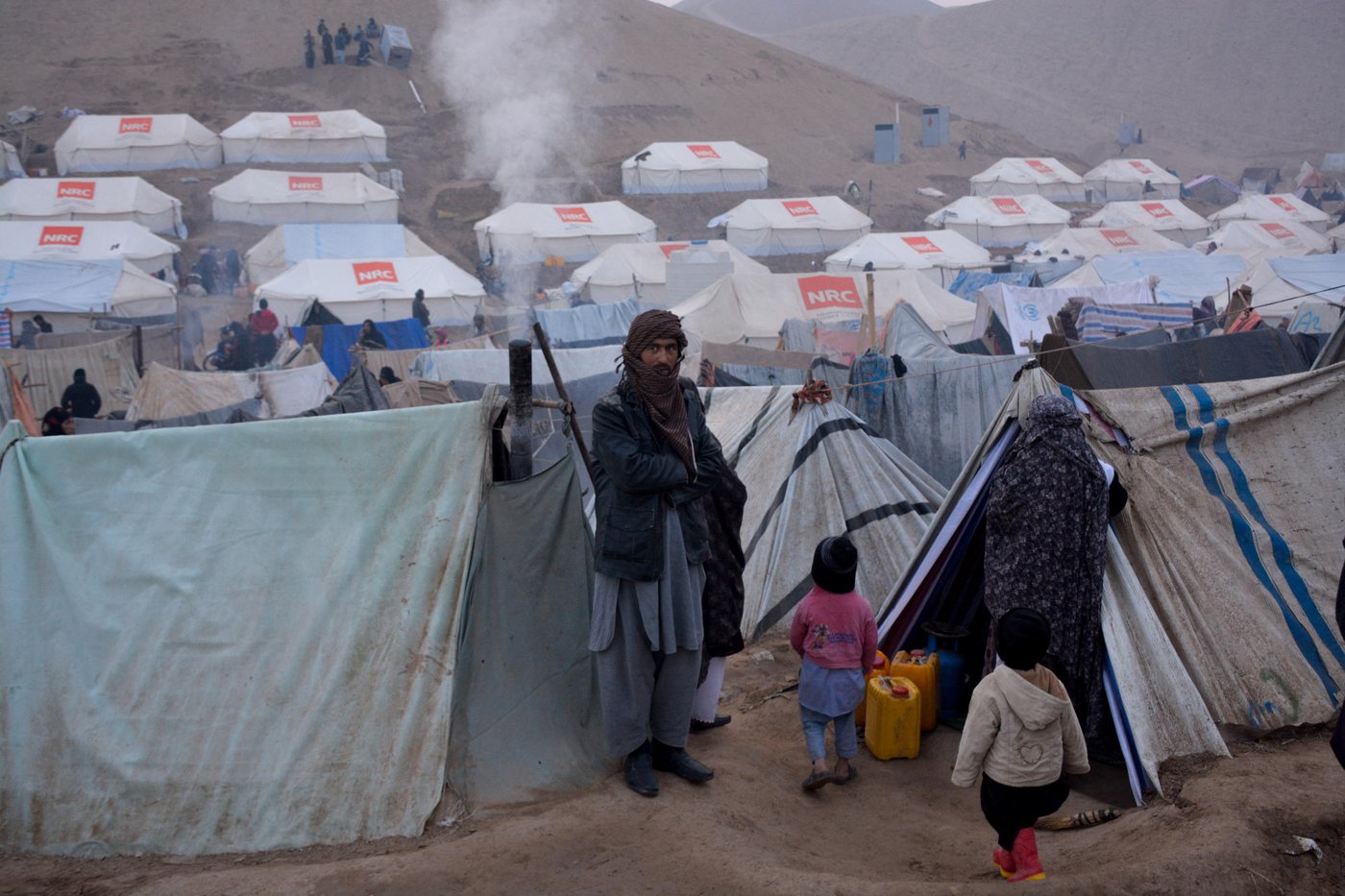 Frigid winter is coming in Afghanistan and many families who have been displaced due to drought and conflict still live in the makeshift tents exposed to the nature.
NRC with support from ECHO is determined to help families to have access to warmer shelter during winter. This is the first delivery of tents to the population since they have been forced from their homes between four to six months ago.
This is Feristan-2 settlement that thousands are l. One out of the seven IDP settlements around Qala-i-naw that host around 4500 families.
This is Faristan-2 IDP settlement situated some 5km northeast of Qala-i-naw city center. The population is growing here day by day as they are moving from their original settlement, Feristan, that was hosting more than 20,000 people. Feristan settlement is situated on the riverbed and families are evacuating the settlement because of the possible flood during winter.
NRC is planning to distribute and erect around 2,500 tents and also help thousands families with winterization kits and kitchen kits. Photo: NRC/Enayatullah Azad