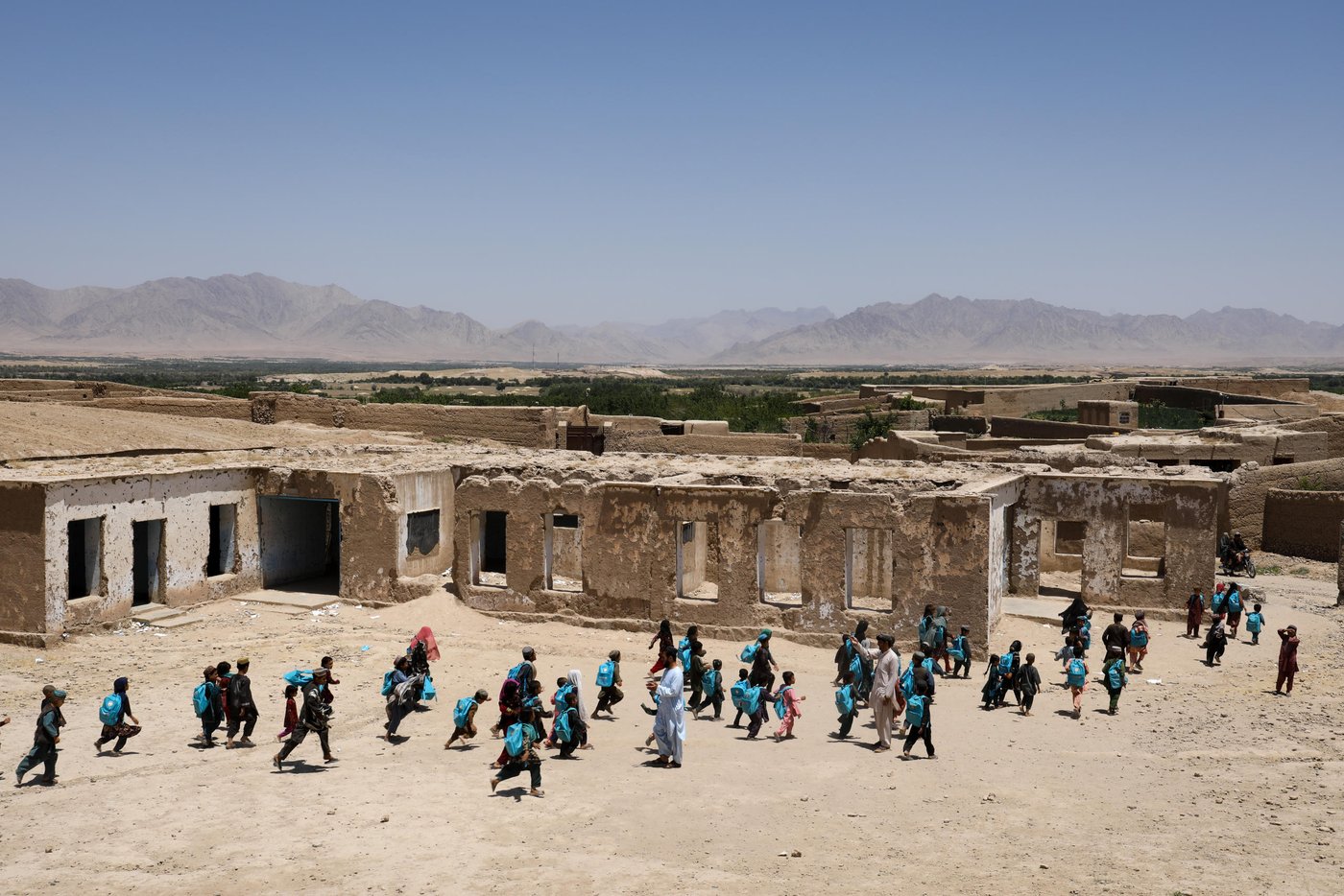 Once, hundreds of girls and boys were attending in Onas Sarshakhli Primary School in Trinkot and still there are some around 300 girls and boys gathering in the coordidor of the school to get education. The Sarshakhli village was collapsed to the Taliban and they used this school as their base to fight against the Afghan military forces. Now, they have been pushed back but the school still remain the same. Thousands of girls and boys would have studied here if there was enough funding for rebuilding this school. Photo: NRC/Enayatullah Azad