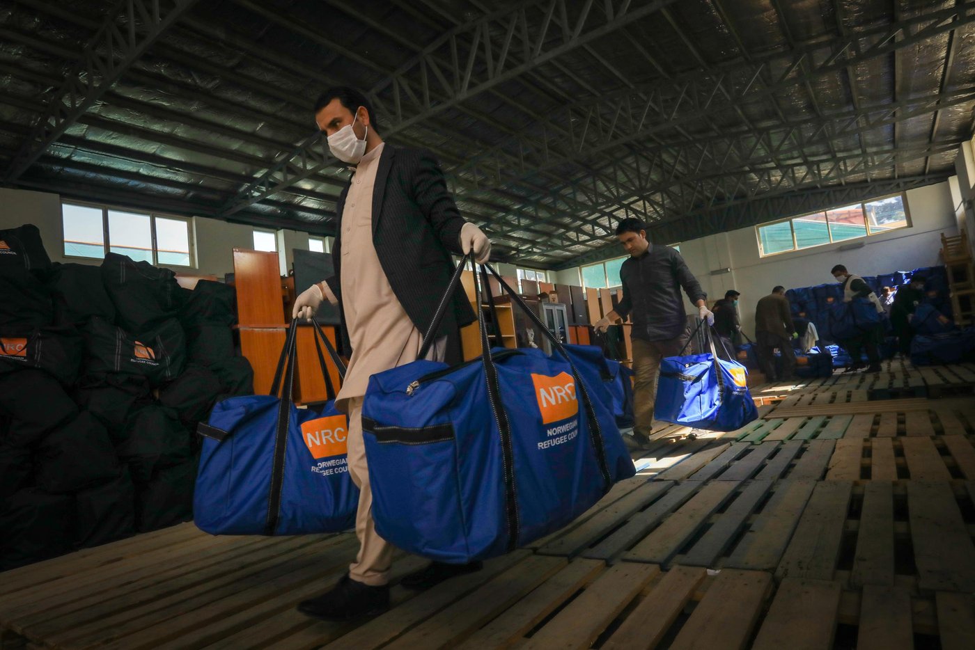 NRC staff have packed the hygiene kits and now loading it to truck them to the informal settlements in Kabul. NRC distribute hygiene and sanitation kits to 4,500 households in nearly 20 different settlements in and around Kabul city. Photo: Enayatullah Azad / NRC
