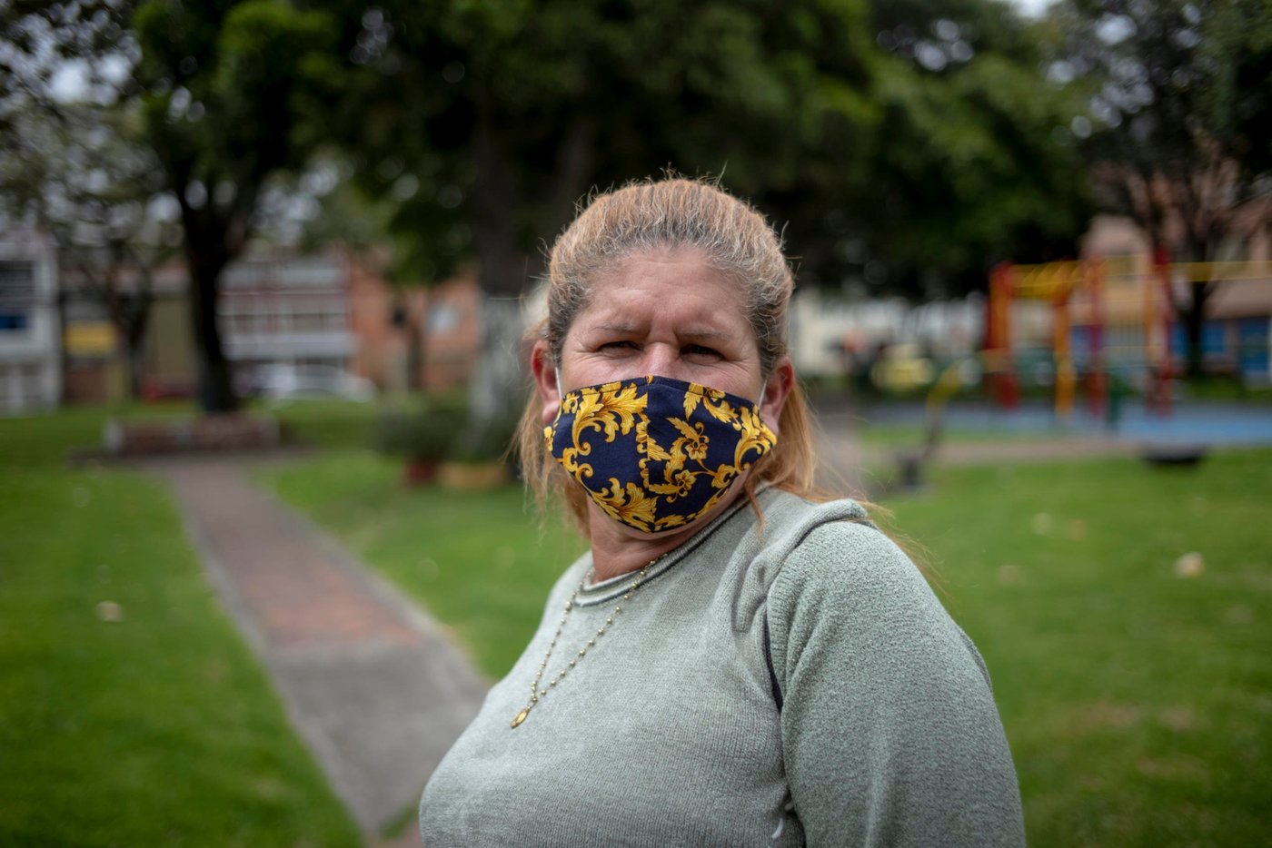 June 25, 2020. Bogota, Colombia: Lisbeth Chiquinquira (53) is originally from Maracaibo. She has 7 children, of which only one is still in Venezuela. There, she has a little house. But in the five years she's been gone, the house has been abandoned. At first, she lived in Becceril, near the Colombian Caribbean coast with her sons and daughters. They were paid to keep a house; but when it was sold, Lisbeth came to Bogotá, a year and 7 months ago, with a daughter and two of her grandchildren, aged 12 and 9. "Here I am working selling coffee on the street. Thank God, I did very well last year but with this cvid-19 issue, I haven't been able to work. I go out with my thermos, but the covid with the coffees... it doesn't happen! People don't buy out of fear. Before in Venezuela, I worked in a family home, I was an employee." (...) “This year, yes, it has made me quite difficult. I don't have to give up my son who is in Venezuela, who has two children. Yesterday he called me and said: Mommy, I want to leave. But no! The situation is very difficult. Just to bring him to Maicao [on the Colombian side, near the northern border with Venezuela], they are charging 100 dollars. And from Maicao to Bogota... other money... And since they're not letting anyone through, I have him there, in great need." When asked what her hopes are, Lisbeth replies: "That my country will return to what it was and we will return! Yes, I am very grateful to many Colombians, but yes, I would like to return to my country. There is my family. There is my little house. I have a sister, I have nephews and nieces. I have faith in God that one day it has to happen. Each one of us must return to our own homes, to our own country. To live our life, as we lived it peacefully. Happy. We were very happy." Credit: Nadège Mazars for NRC