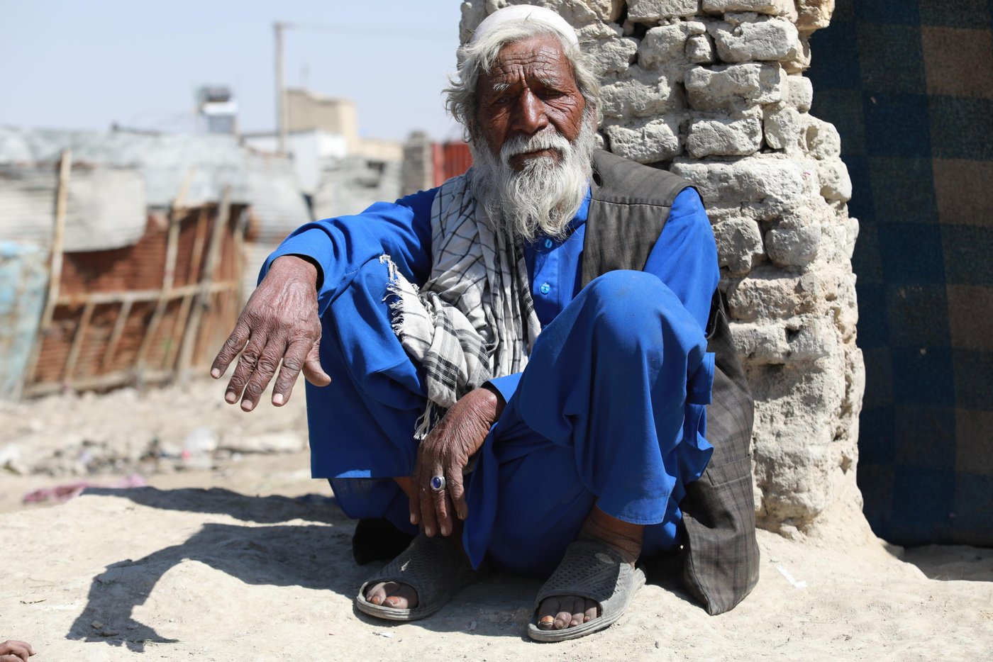 Sharbat Khan, 80, living in an IDP settlement in Kabul. 

Quotes: 
“We have heard that we should keep ourselves clean. Not touch out nose, mouth and eyes, but Allah is the savior and we can’t do to protect ourselves. I have left enough in this world and I’m not afraid of these diseases. We live our normal life and can’t cut or add anything to the routine. We can’t keep food as we can’t afford and there is no place to store them. We can neither limit our movement. They moment we stop our work, we no longer have in the hand to eat.” Photo: Enayatullah Azad/NRC