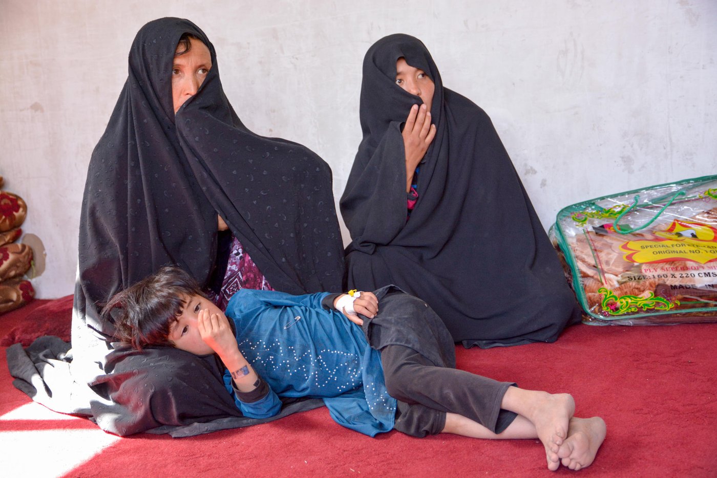 Dordana, 47, and her sister-in-law, Marzia, 28, have left with thirteen children. All male family members even the seventeen-year-old Baqir were killed during the Mirza Olang attack on August 5.
The armed militant group blocked the way while the family were fleeing from the village. The Taliban have separated the male family members and killed and took the women hostage.
Dordana, her sister in law and the children fled after three nights being hostage in their homes in Mirza Olang village.
NRC with support from ECHO have responded to the family with 28,000 AFS in order to cover the needs in terms of Shelter, fuel, electricity, health, and transportation.
Photo: NRC/Enayatullah Azad