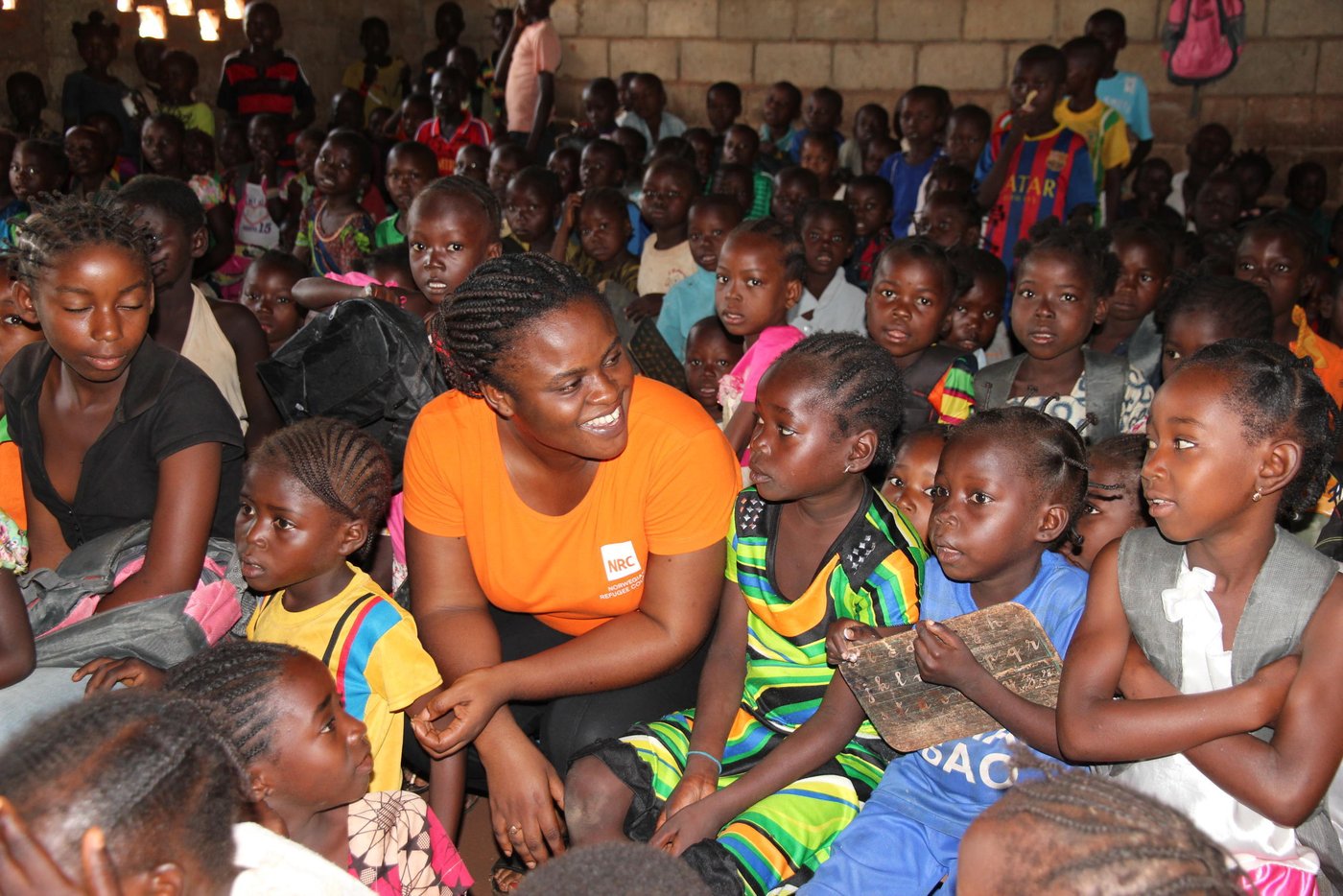 The classrooms in the Gbagaga school in Carnot are crowded. The school has more than 500 pupils, but only three classrooms. Therefore the grades are sitting together; 1st and 2nd, 3rd and 4th, 5th and 6th grade. To educate as many as possible at the school, they have two shifts per day, in the morning and in the afternoon. 
The learning material is quite basic. The each child has a small wooden, black painted board. On one side the board has the alphabet and number 1-10, on the other side, the children writes with small pieces of chalk. Photos NRC / Ingrid Prestetun