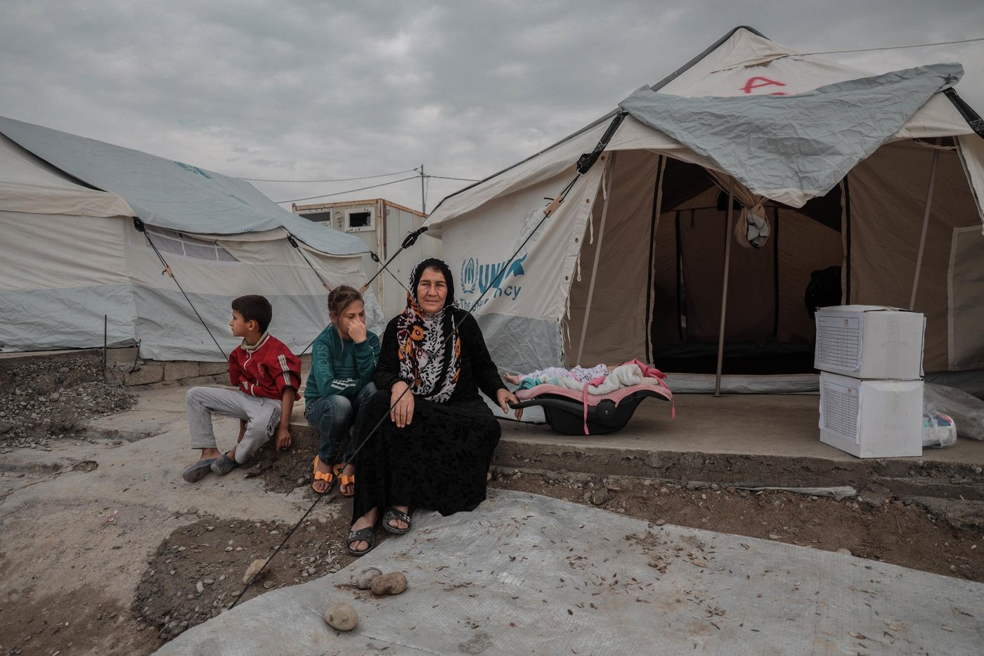 26.10.2019
Zubaydah had to flee with her family due to Turkish military operation in northeast Syria. She crossed the border and found refuge in Bardarash camp, where she stays with her children and grandchildren.
"There were airstrikes and shelling every day on Raas Al-ain, many people got killed, we had to flee to survive," she said.
"When we arrived at the camp, we were exhausted and we had nothing. People helped us a lot, they gave us a tent, mattresses, blankets, hygiene items and food," she added.
As a part of our response, we distributed 250 Hygiene and 250 Dignity kits in Bardarash camp. Our team visited families tent by tent to deliver the kits. In addition, 1,500 mattresses and 250 heaters will be distributed as well as 291 pregnancy kits and 2043 baby kits on their way from Mosul.
"These kits will help us to keep our dignity, that's all we have left. We will be able to wash ourselves and it will allow us to keep the baby clean and healthy," said Zubaydah.
Photo: Alan Ayoubi/NRC