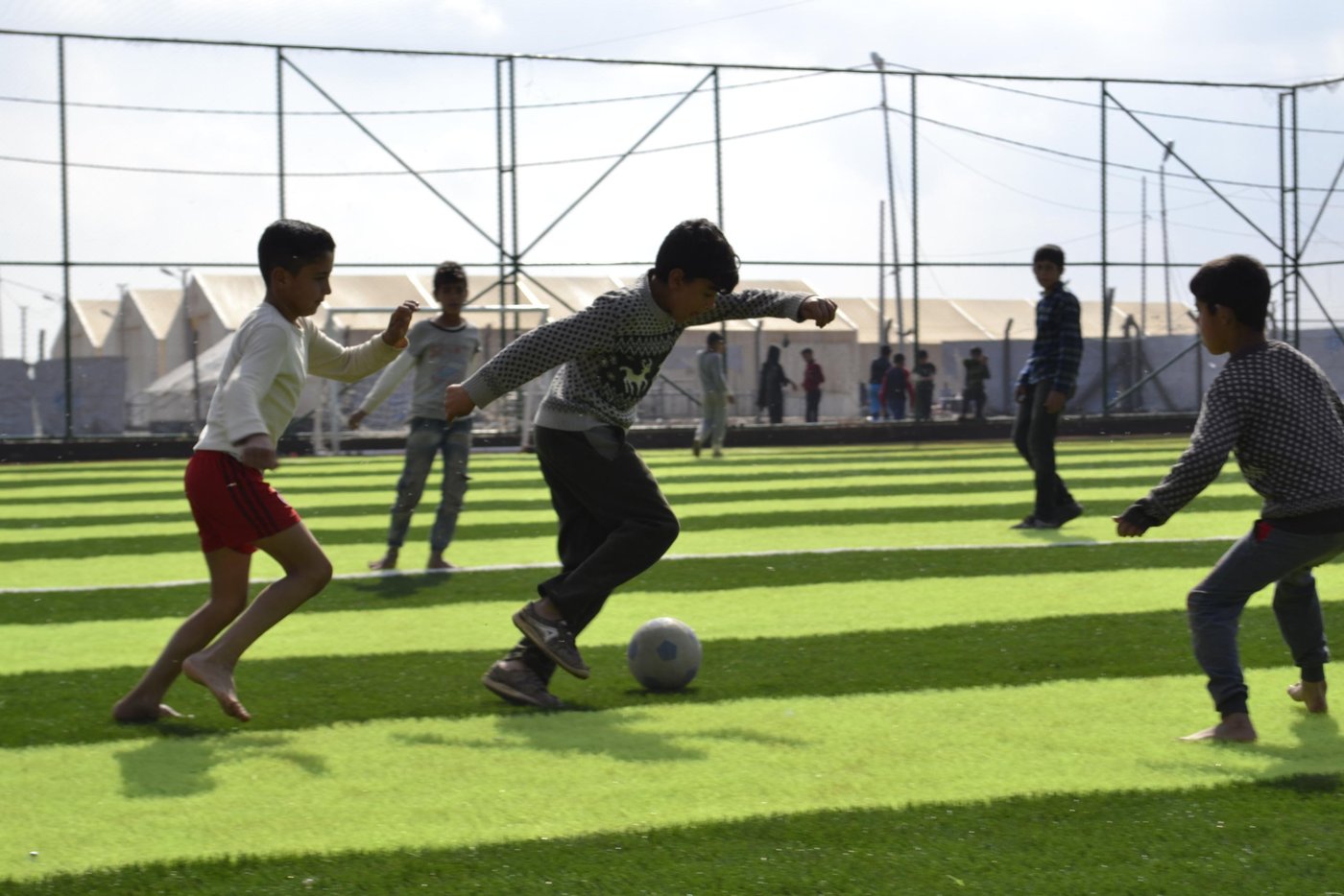Many people in Hamam Al-Alil displacement camp in northern Iraq have lost their homes, loved ones, families and friends - but not their passion for football.  It’s become a way for them to make new friends and keep the positive energy.
Photo: Helen Baker/NRC