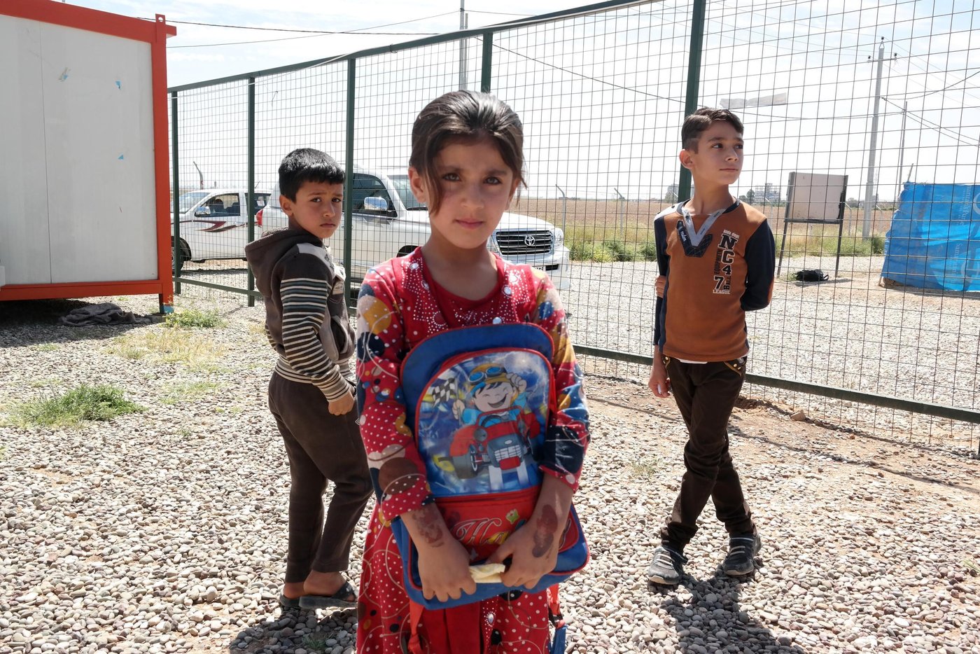 Ola (8) years is an Iraqi internally displaced. She lives with her family in Harshm camp, Erbil, Iraq and attends NRC's school support centre where the children learn Arabic, English and mathematics two hours every day. This day she came too early for class and had to wait outside. The teachers tell us that this often happens as the children are very excited about coming to the centres to learn.

In the KRI, the IDP population reached over 1 million people in December 2014, of which 47,300 IDPs are children under 5 years old and 274,000 are under 18 years old, very few of them have access to education. In Iraq 75% of all IDP children  (487,500) are out of school and not attending formal education. 

NRC has developed an education response approach that support the two governments (KR-I and Iraq) in the provision of education in emergency programs, basic education services and youth education. School Support Centres (classrooms/TLS and facilities for capacity building of education personnel) are established in areas with high concentration of IDPs (camps/host-communities) and NRC use these centres and the IDP education staff to cover gaps in the provision of services.NRC is assisting the schools with additional learning spaces and our education personnel (teachers) are filling gaps in the formal school. We are also providing bridging classes to children that due to the conflict and their displacement have been without school for a period. These children receive extra lessons, enabling them to later join the formal school system. NRC is also focusing on the psycho-social needs of children and the involvement of parents and other community stakeholders. The approach allows for NRC to facilitate the smooth running of the education activities in the area, with distribution of needed TLM and coordination between schools belonging to different education systems and with different curriculum.

Photo: NRC/Becky Bakr Abdulla