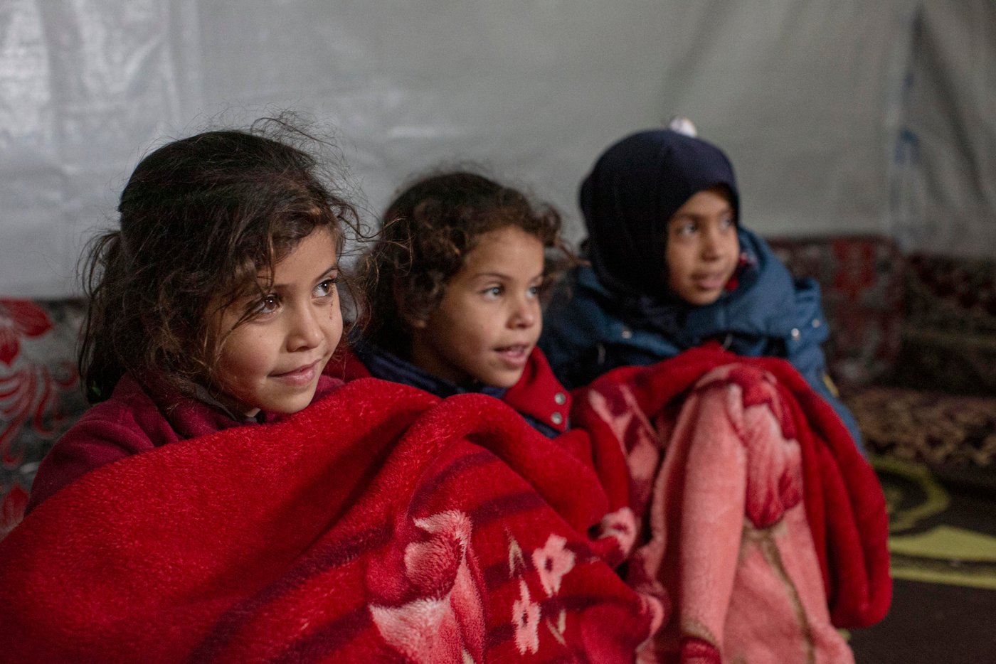 Their family fled their home in Qusayr, Syria, in 2011, when their home was bombed. The Norwegian Refugee Council helped the family by installing cupboards and supplying material to cover and reinforce their tent, as well as installing and maintaining toilets in their settlement and supplying drinking water.
Photo: Sam Tarling/NRC
