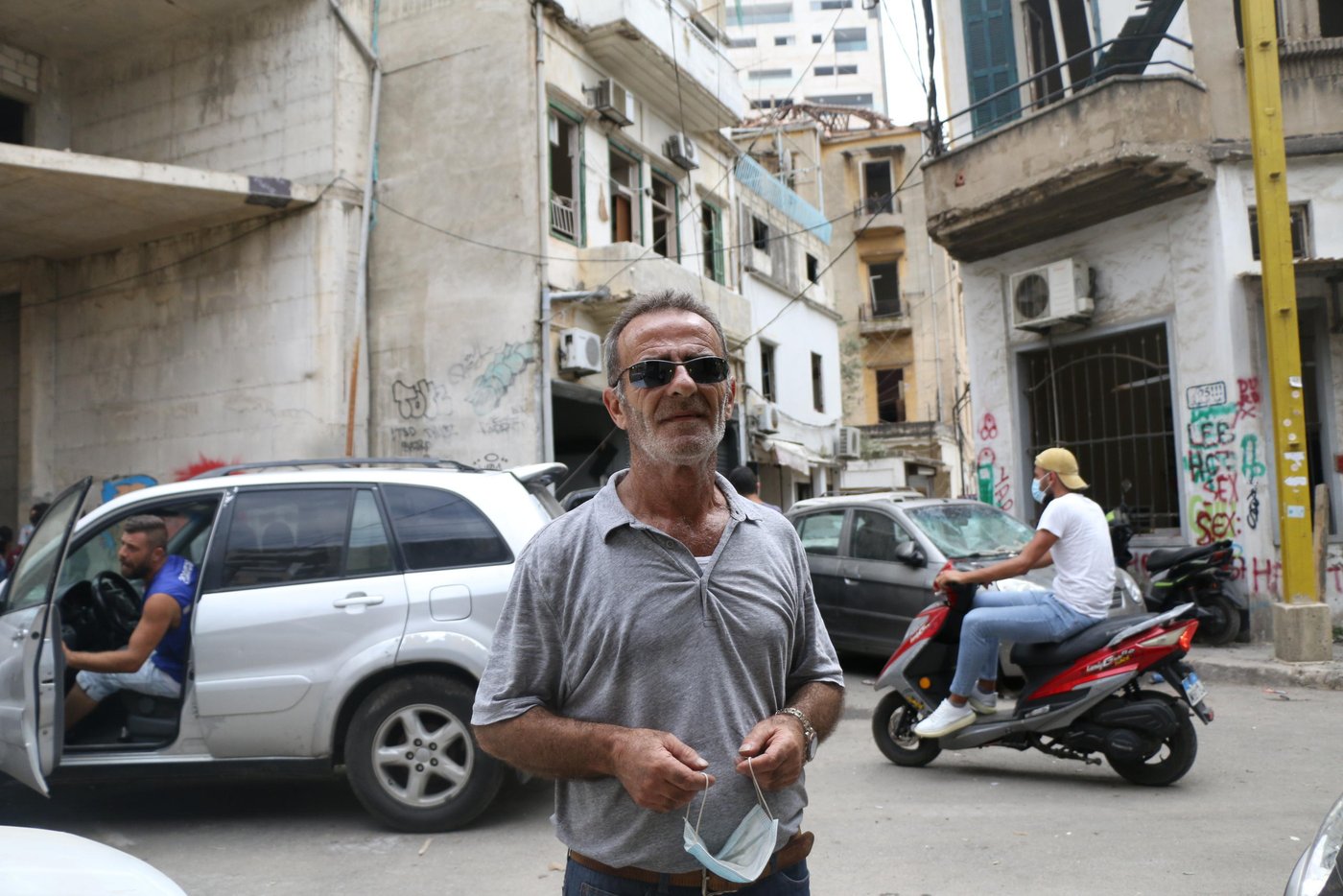 Movses was at his house when the explosion happened, he ran to the balcony immediately when he heard the sound, the blast threw him, his wife and his 10-year-old daughter away. "When we regained consciousness, I didn't believe my eyes, everything was destroyed, it was like an atomic bomb", Movses explains, "I couldn't find a place to stay at with my family, so we are sleeping in our damaged house, what else can we do?" Volunteers helped Movses cleaning his apartment and giving assessment, "this is not enough, many people came and promised us help, but honestly, I don't see a point in that, this is hopeless. I want to leave this country, there's no hope for us to stay anymore. Do you want more than that?" Movses was injured on his head and all over his body. "My injuries weren't as painful as seeing my daughter covered in blood, I wasn't able to protect my own daughter." He concluded.
Photo: Zaynab Mayladan/NRC