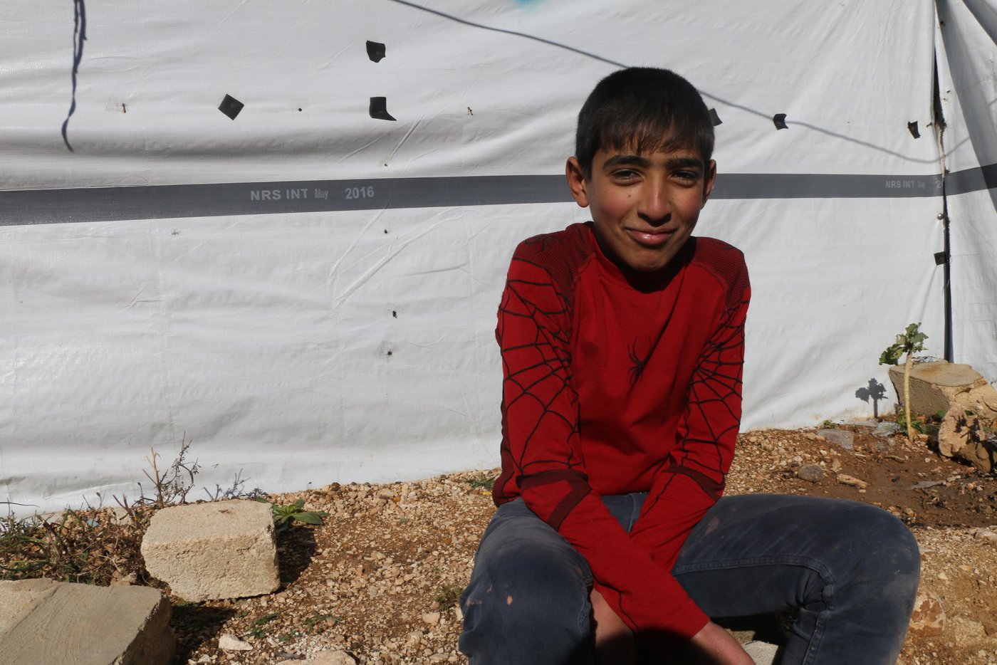 The family are struggling to repair the damage, and are having to rely on the help of their children in the hope of moving back in.

“My husband is trying to repair our shelter with the help of our 10 and 8-year-old sons, Mahmoud and Adnan. They are removing nails, replacing the timber and covering the roof so the tent doesn’t flood anymore. They work as if they were adults,” says Intisar, 36, a Syrian refugee who lives in Arsal.

As harsh weather conditions sweep across Lebanon, thousands of Syrian refugees have been left vulnerable in the hill town of Arsal. The Lebanese government opposes the creation of formal refugee camps, so many refugee families have resorted to living in informal tented settlements.

Photo: Racha El Daoi/NRC