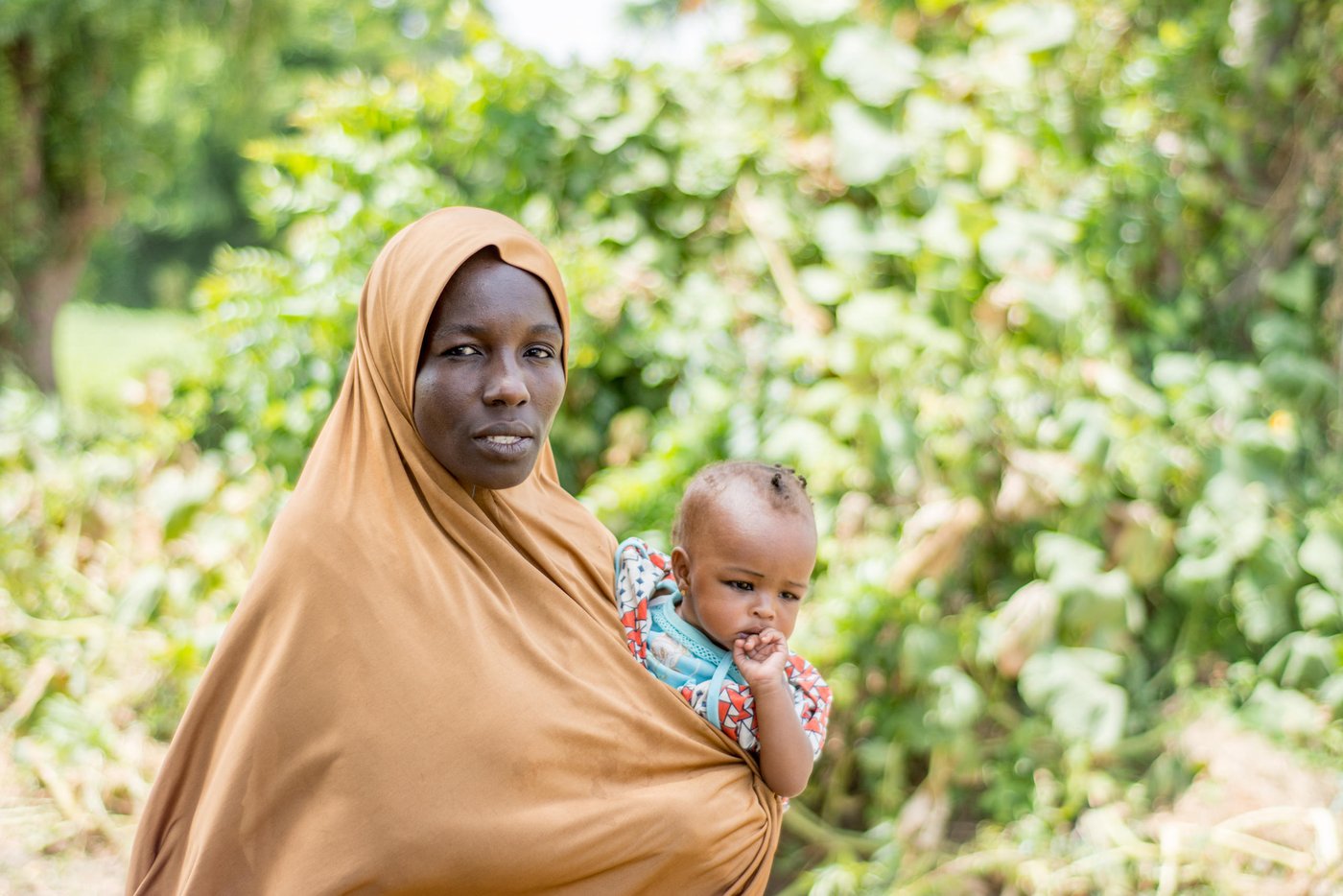 Hajja is a farmer from Maiduguri City that NRC is supporting. She grows and sells cabbage, lettuce peppers and onions. Hajja lives alongside displaced families who’ve fled Boko Haram attacks in New Bama town. 

“There’s a good relationship between our two communities,” Hajja says. “We happily stay together without any issue.” 

Danladi  (there are photos of him later on in this album) is an NRC food security officer in Nigeria. “I teach farmers like Hajja new modern methods, using fertiliser and quick growing seeds. It has been incredible to watch these mini-farms grow. Now the local market sellers come to our farmers to buy their produce. They’ve become successful business people.”

The Norwegian Refugee Council has supported over 500 farms in Maiduguri City alone, the capital of Borno State – the epicentre of the conflict in Nigeria’s northeast.

The region is suffering a triple crisis – hunger, cholera and conflict. While Nigeria has managed to avert famine for now, 5.2 million people still do not have enough to eat. Close to half a million children are suffering from severe acute malnutrition.

Date: 6 October 2017
Credit: Norwegian Refugee Council / Mohamed Bukar