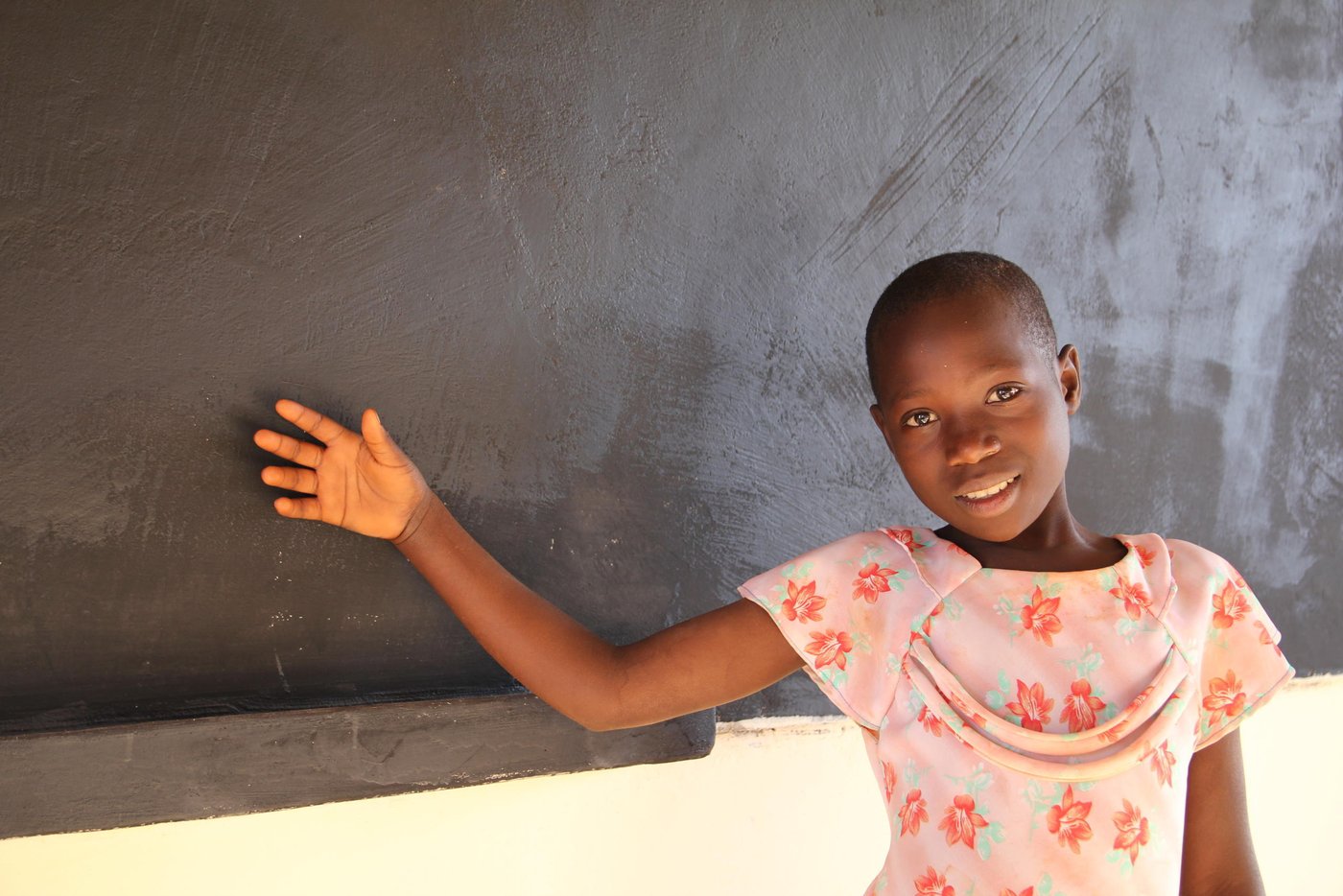 Diane (10), left Burundi while in Class Three at Kumwumi Primary School. However, while at Mtendeli refugee camp in Tanzania, Diane has not been able to resume school. She lacks the basic learning materials. “I do not have clothes, shoes, books, pen, ruler and a school bag,” she says.
However, Diane is excited about the prospect of returning to class. She is one of the pupils who will start schooling at the primary school being constructed by NRC in Mtendeli.
Diane quotes (from June 2017 interview):
“In Burundi, I liked to study. I had materials: clothes, shoes, exercise books, rubber, pencil, mathematical set, pen, shoes and body lotion.”
“We had a charming teacher who made us laugh. The school was built well and I had a friend.”
“In Burundi, I had a friend. I miss my father. I miss my friend. I miss my teacher who made us laugh. I miss my home.”
“What made us flee was political warfare. People were killed, taken at night, we could not know where they had taken them. Even my father, they took him at night.”
“In Burundi because there was a selective war, I stopped school for one year. I see they are building schools here. I pray that I also study here.”
“In Burundi, I likes Mathematics, Kirundi. I want to teach. I want to become a teacher too.”
“At school in Burundi, I likes Mathematics, Kirundi. I want to study. I want to become a teacher too.”
“In school, I likes Mathematics, I liked Kirundi, I wanted to study very hard so that I become a teacher too.”
“I see they are building the school there. I am happy because they are building. I will also go to study there to get knowledge.”
“I am hoping I will also be taken to study at that school.”
“I am happy because I see they are building the school and I have been selected to study from that school.”
“Thank you for listening to my story.”
“I hope I will get teachers who will make me laugh like those that I had in Burundi. I hope I will get friends as those I had in Burundi.”
Lyrics of her song: “When Petro was still young, he saw other children going to school, he escorted them. On the way he turned back, while very sad, then he told his parents, to bring him to school. When he started school, he did not delay to finish, and now he succeeded, he is teaching other pupils. He is teaching other pupils.”
Photo: NRC/Ingrid Prestetun
