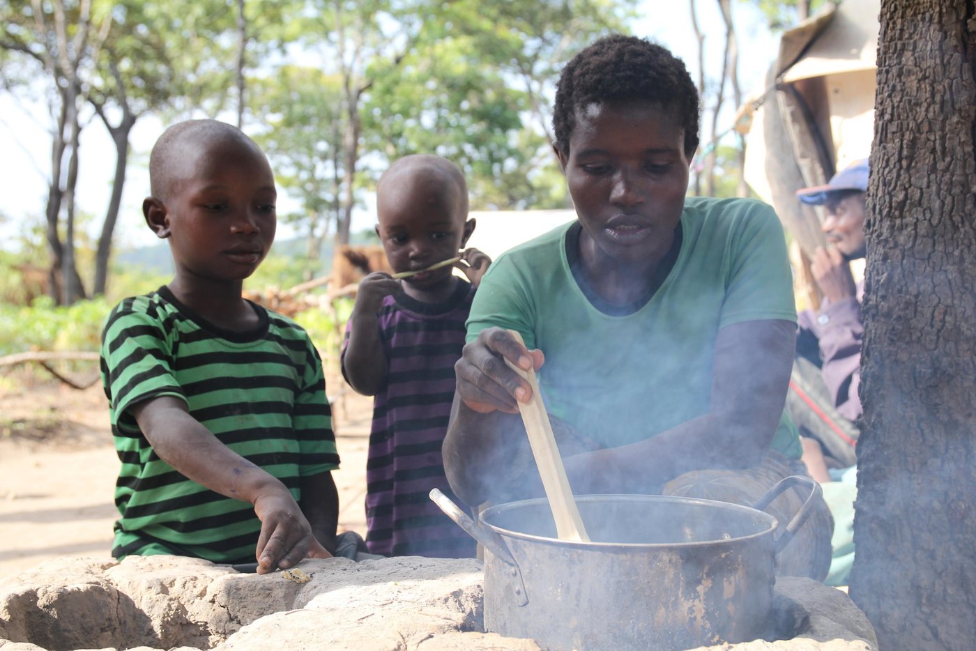 Niyongere is 10 years old. His parents are called Sebizigiye and mother Marianne. He lives in Nduta refugee camp of Tanzania. He recalls his young life back in Muremera Village in Ruyigi Province of Burundi when every night, armed men would come looking for his father Sebizigiye. His father would hide under the bed. The men would threaten to kill him when they found him.
Their home area became very insecure due to political instability. Men with dark motives prowled the streets at night. Even walking to school in the morning became very dangerous. One day, one of his classmates was killed on his way to school. He heard about it during an announcement by his teacher Mrs. Nishimiye. He had also lost contact with his best friend Sengiyuva before leaving Burundi, and has never heard from him again.
He likes Mathematics. “Maths helps me to learn how to count numbers. I am fascinated by numbers. I can count from one to ten in Swahili, English and Kirundi,” he says. While in Nduta refugee camp, Niyongere’s best friend is called Mugisha. He dreams of becoming a teacher when he grows up. He thinks teaching is a very noble and fulfilling work.
However, he lacks learning tools like pencils and books. To help him during class, he borrows from the teacher or from other students. While at home, Niyongere has improvised a new method of doing homework. He has kept aside stones that he uses to write on the soil outside their tent.
During his free time he goes to fetch water from the river. He also spends time looking for firewood. Together with Mugisha, they like to play football. They also play cards, which involves picking cards from a pile and displaying in turns. The person with the highest score wins. He says that he wins most of the time. In addition, Niyongere, whose name means ‘give me more’, spends a lot of time chatting with his father. When he was born, his parents offered a prayer to God to give them more children. His says that his father encourages him to love education. He helps his mother to cook.
Quotes from Niyongere:
“I miss the school where I was studying. In Burundi, I had school bag, shoes, clothes and pens.”
“I miss the school where I was studying in Burundi. I had enough materials: shoes and clothes, pens and a school bag, rubber. I also had friends who loved me so much.”
“But here I do not have materials. I do not have exercise books. When I want to write, I borrow papers from friends or the teacher. He gives me a paper and pen and I write. Also we sit on stones.”
“I am happy because I am in the camp. I get peace. Even though we do not have built schools, they will help us.”
“I want to study with all my efforts so that I finish studies and become a teacher, as I want to be in my life.”
“I like school so much. I also like to learn.”
“You see, in Burundi I had exercise books, pen, school uniform, school bag, shoes. But here, I do not have them.”
“You know, I left the school in Burundi when we came here.”
“We decided to flee Burundi because there was conflict. They were hunting for us, they wanted to harm us. That is why we decided to come here. We left because they wanted to kill us.”
“I feel better because I left a conflict area to come to a non-conflict area, to live well.”
“You know, in Burundi I had friends. One of those friends was Tuyisenge Moses. Another one was called Niyibitanga Sekis. Another one was Nakayibona Methode.”
“You know, in Burundi we could farm tomatoes, cassava or farming maize, or farming vegetable or peas, we also kept goats. I had friends but I do not see them here.”
“I miss the school where I was learning and friends and home and relatives.”
“Because we are studying in the open sometimes people pass by talking and we are distracted. We cannot follow the lesson well.”
“When another teacher is teaching a nearby classroom, we look at him and fail to follow our teacher.”
“I like to be a teacher so that I teach other children like how I am being taught”
“At home, my parents, siblings and myself we were afraid that they would harm us. I used to hear that others had the same problems.”
“But when I heard that we wanted to come here, I became happy.”
“Thank you very much for telling my story.”
“I miss my exercise books, pen and school bag, school uniform and shoes.”
Photo: NRC/Ingrid Prestetun