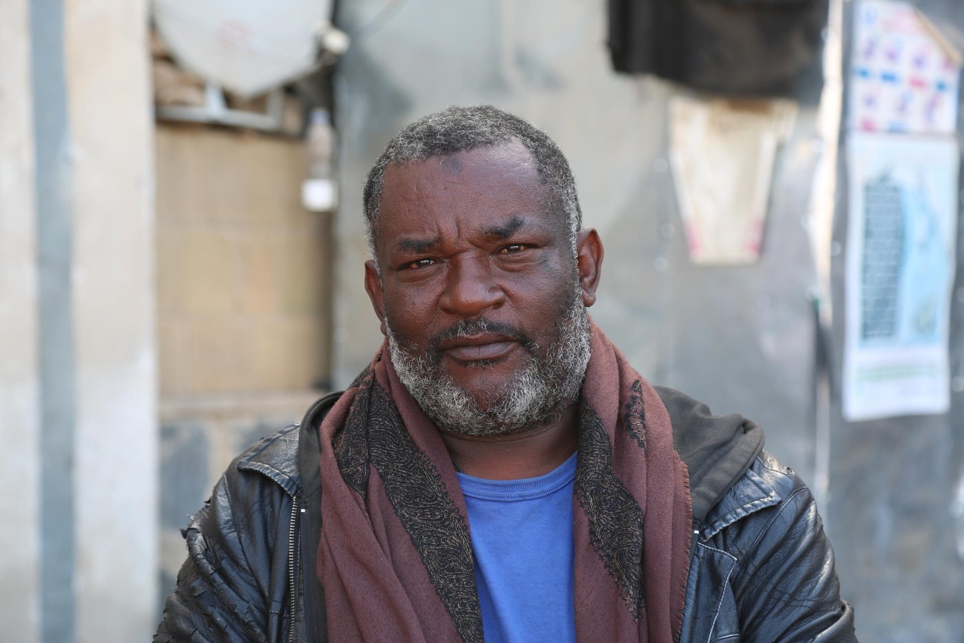 Al-Raboui Adbu Saeed is in his 50s and is a father of eleven children. He is from an area of Taiz city where hundreds of families live in informal settlements. The families are part of a minority ethnic group called Muhamasheen. The group has long suffered from caste-discrimination, poverty and exclusion.
Al-Raboui was proud of the life he had. He worked as a driver for a cleaning company and his salary was enough to cover all basic commodities. His home was his castle. But this all changed when the conflict arrived in Taiz.
“When battles arrived in the area we immediately fled because delaying may have led to casualties among civilians. Battles don’t differentiate between civilians and fighters,” Al-Raboui says.
Al-Raboui’s family, and others in his community, found refuge at the school, 70 km from home. The school had been transformed into a camp for displaced people, and Al-Raboui says that they were welcomed at the school by both residents and the local authorities.
But now, the overcrowding in the few classrooms still available is causing disputes between those residing there and the teachers and parents who want their children to continue learning.
In response to the impact on education, the local authorities provided the displaced families with alternative land. However, it wasn’t safe for them.
“We took ten tents and went to erect them in the new land,” Al-Raboui recalls. “But the owner of the land came and stopped us.”
Al-Raboui contacted the sheikh of the area, as well as the local authorities. They agreed to meet next day to resolve the dispute with the owner. But this was unsuccessful, and the families returned to the school later that night.
“The residents and the local authorities demand that we leave the school because they need it. We agree, but we can’t return to our houses and we don’t know any safe place to go.”
“All we need is to live peacefully,” Al-Raboui concludes. Al-Raboui says. “It is impossible to return our houses in at present. We are willing to leave the school but we need a safe place for us and our children."
Text and photo: Nasser Abdulkareem/NRC