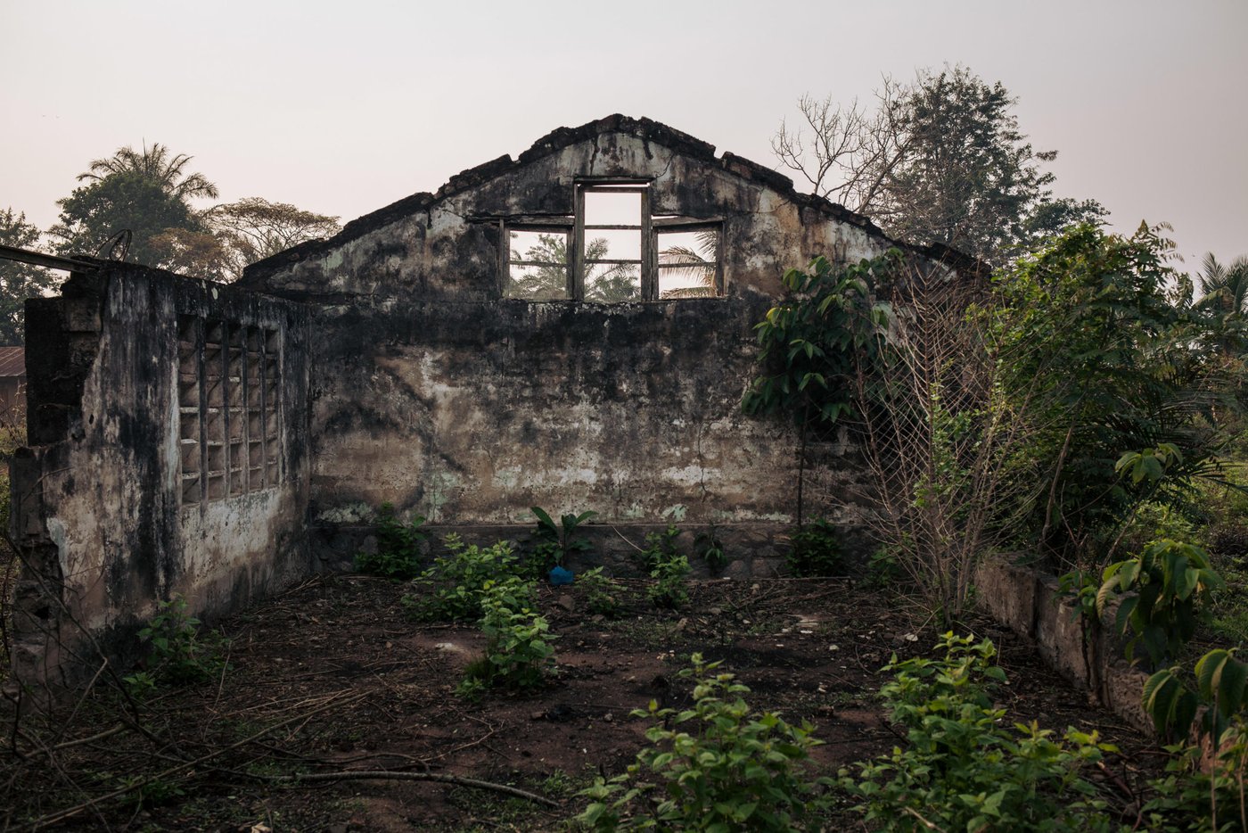 View of the ruins of an administrative building in the village of Mbulungu. In early 2017, armed militias took control of the area. They systematically destroyed official buildings and attacked government officials.
Over 1 million people have returned to their homes in Kasai-Central after a year of violent conflict within the province and across the Greater Kasai Region. Unfortunately, people who have returned have found their homes and fields pillaged and burned to the ground. These farming communities have no shelter, no food to eat and no means of sustaining any viable livelihood.
Earlier this year, NRC visited Mbulungu and Bakuakashila, two villages ravaged by the regional conflict in 2017. NRC used its “community-based approach” by consulting with these communities to better understand their primary needs, to properly target the most vulnerable people and facilitate their ability to choose the assistance they require.
This intervention, however, is only a drop in the ocean of the vast needs of this community. NRC is currently the only humanitarian actor in the zone and funding is not enough to address other acute needs such as food assistance, household items and education. The Humanitarian Response Plan is currently only 25 per cent funded eight months into the year. Humanitarian capacity is critically low. If donors do not act now for the people of Mbulungu and for the rest of DR Congo, it will be too late.
August 29, 2018 - Kasai-Central Province, DR Congo
Photo: NRC/Aléxis Huguet