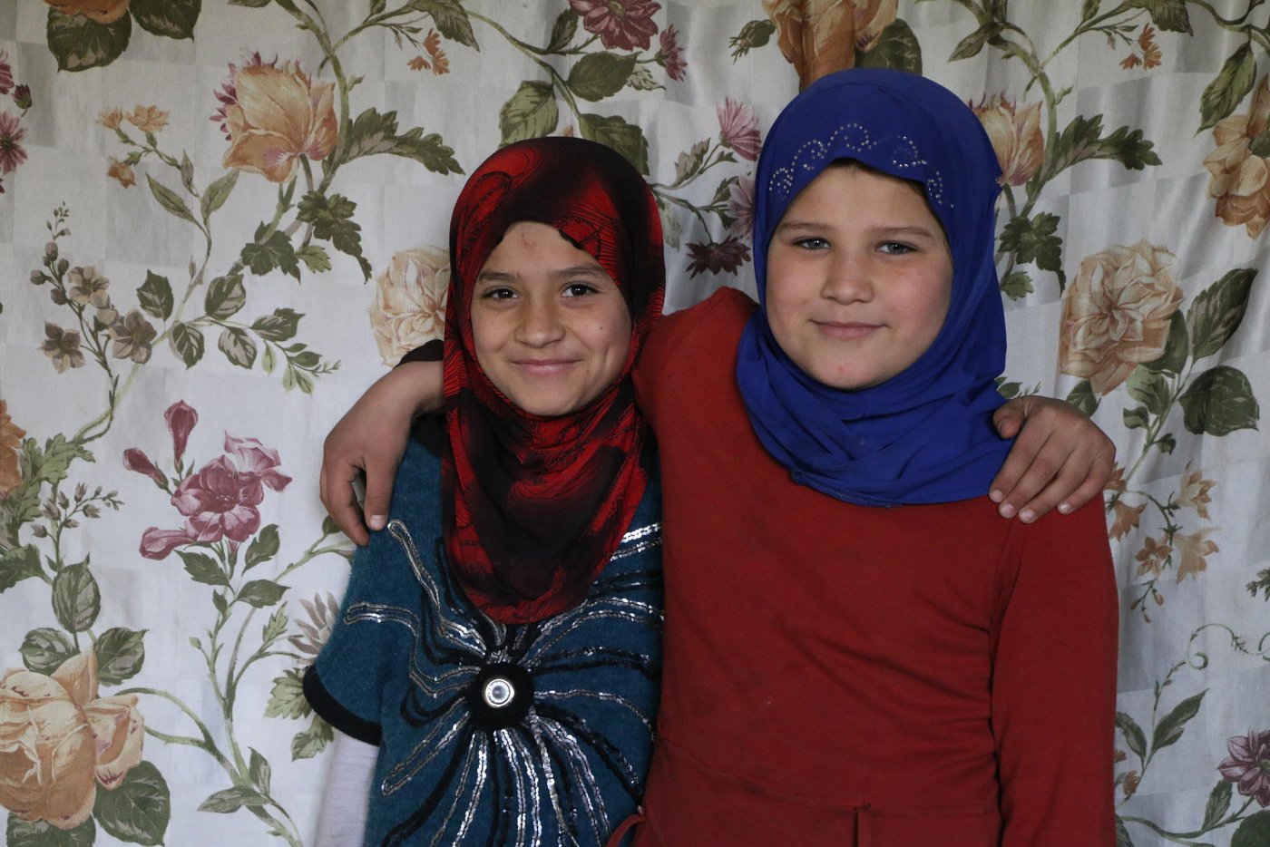 The girls, Aya* (9), and Sarah* (10), who want to become teachers in the future, created a small corner in the sitting room where they study their lessons and write their Home works.
Photo: Nadine Malli/NRC