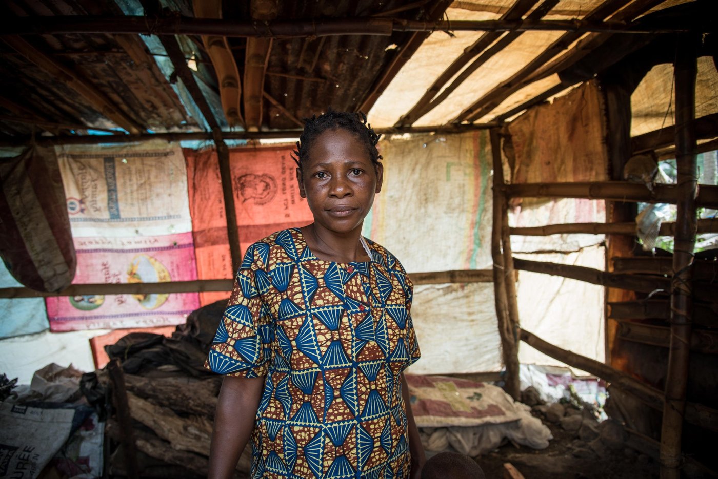 Minette (38) and her family fled from Manyu and sought safety in Buea after their home was burned down. They have received some plastic sheeting and utensils from NRC, and they have built a temporary kitchen at their new place in Buea.

Photo: NRC/Tiril Skarstein