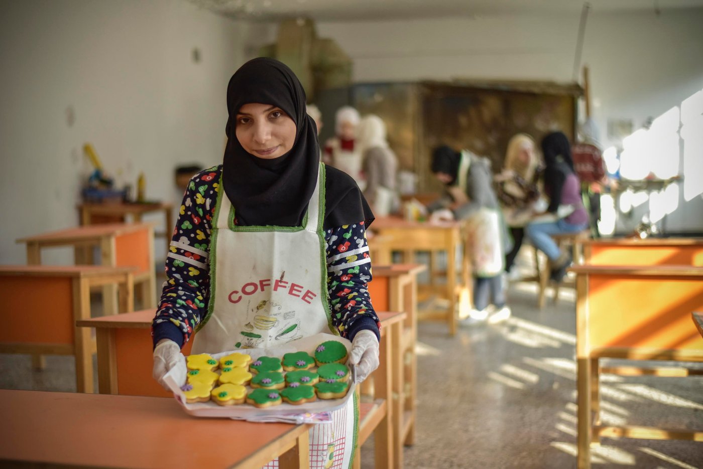 "I’ve never worked before, but through this programme I’ve learned how to make cakes, cookies, cupcakes and other sweets. I am planning to open my own cake shop one day,” says Weam, 24, one of the participants of our youth programme in Syria.
This type of programme offers flexible pathways to youth who have not completed a basic education or who are unemployed due to the effects of the crisis. It focuses on encouragement and life skills, and opens up new opportunities for livelihoods and personal growth.
Photo: Tareq Mnadili/NRC