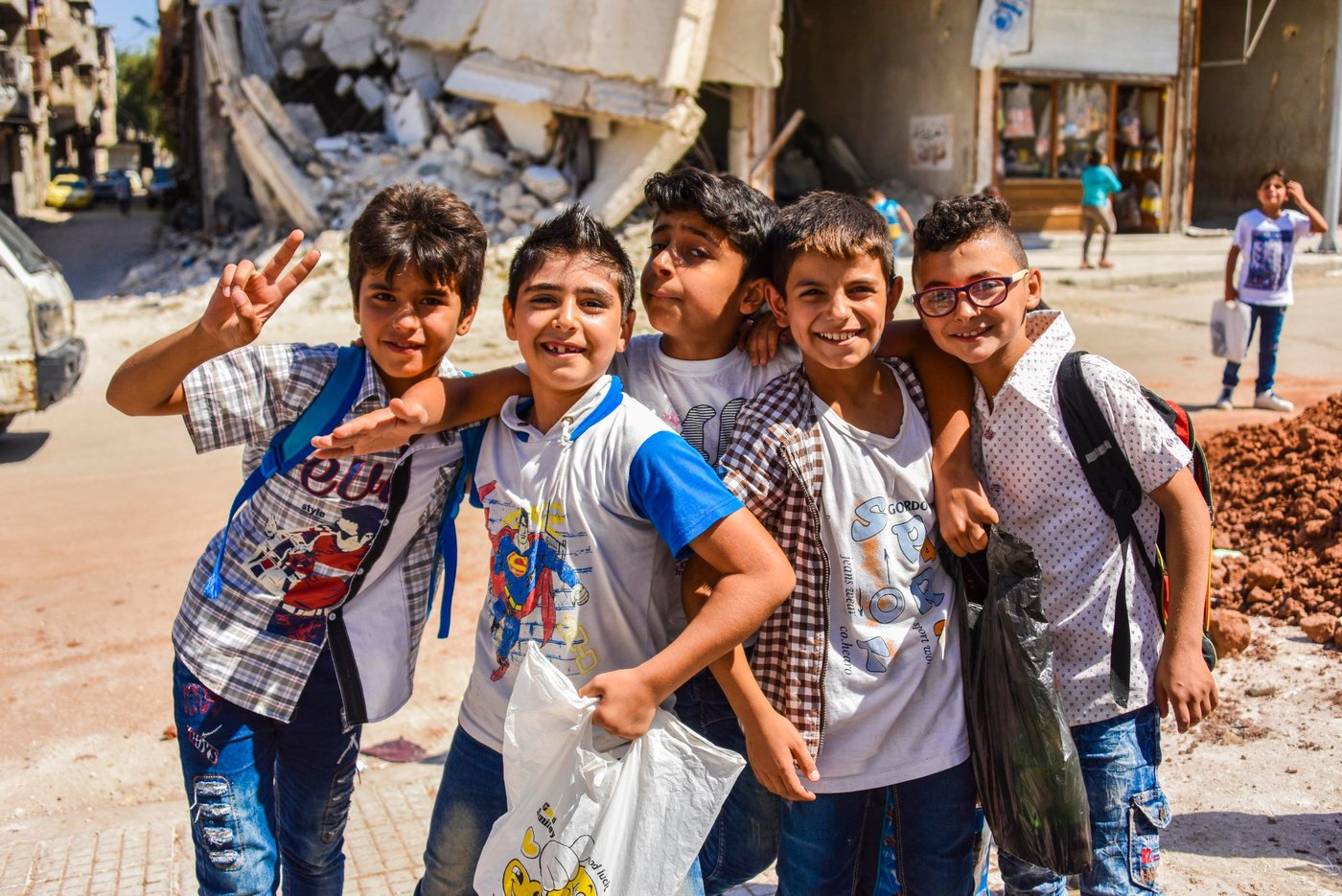 A group of students find joy in the final minutes of summer school in Katarji neighbourhood, part of NRC’s Child Education Program in Transition August 2018.. Katarji was one of many neighbourhoods in Eastern Aleppo affected by the conflict in 2016,
Photo: Tareq Mnadili/NRC