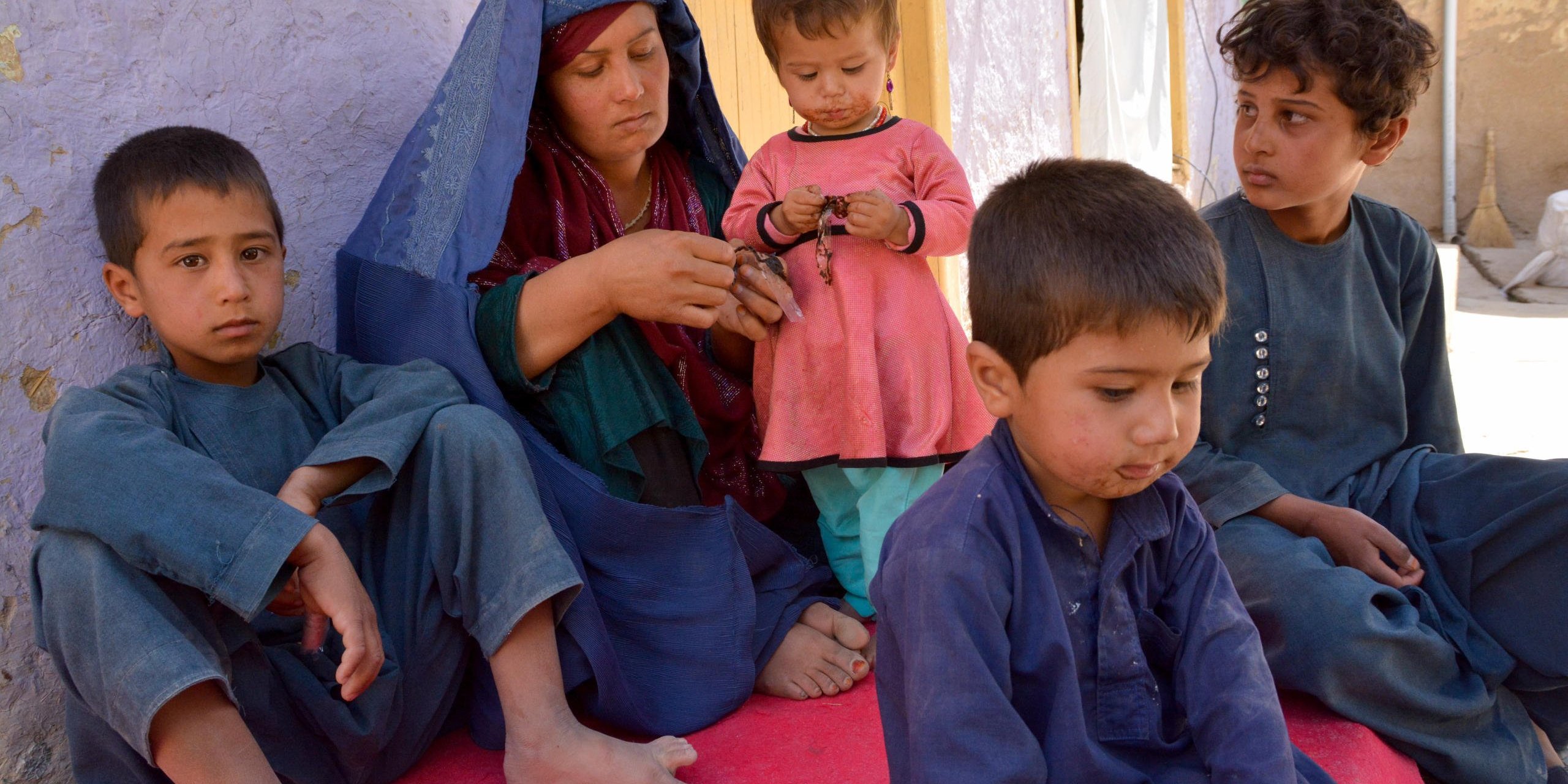Gul Hussian’s sister-in-law Adila, 37, and her four children was among 235 women and children that was abducted by the Taliban militants.

Adila and her husband, sayed hassan, tied the children on back of family donkey and tried to escape from the village, when the Taliban advanced further in the village. They walked in the dark for almost two hours.  But the armed militants cut off their route in the valley, stopping them from reaching safety in the provincial capital.

“When the armed [militants] blocked us, my husband stood by us. He didn’t leave. My brother-in-law escaped and requested him, but he couldn’t leave us.”
The Taliban militants took Adila’s husband and his 13-year-old son, Kumail. He left her son later and killed her husband.

“His hands were tied on the back. The Taliban was pushing him forward and he was turning his head back seeing us. Wish he escaped; he would be alive now,” Said Adila. And now, Adila has to take care of three son a daughter alone.

 “My father pledged Taliban commander to release me, he let me join women” said Adila’s son Kumail.

Kumail was terrified and can’t sleep properly now, said his mother.
Photo: NRC/Enayatullah Azad