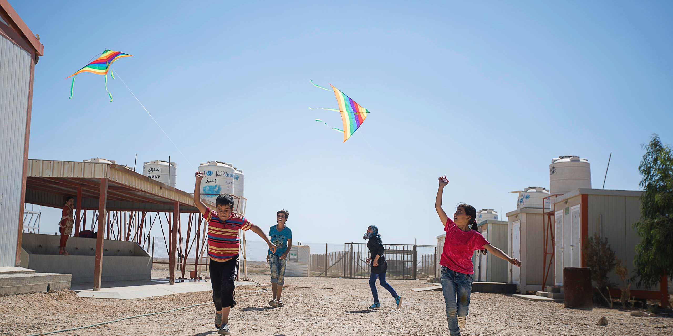 Children flying kits at Zaatari Refugee Camp, 2016.
Photo: Hussein Amri/NRC