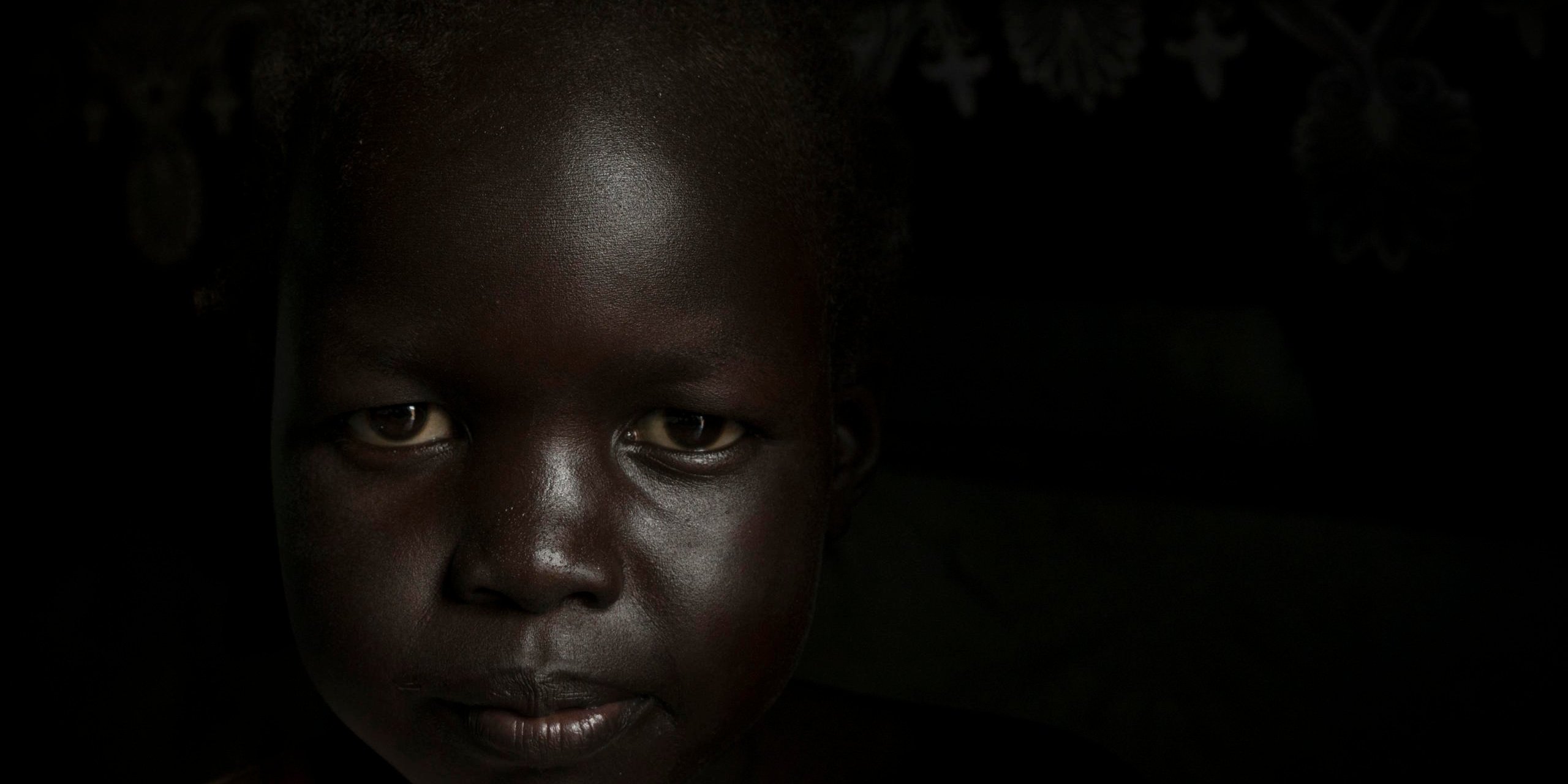 Nyanua Tut, 8, in her home in the Protection of Civilian site for displaced people in Juba, South Sudan, August 10, 2016. ©NRC/Adriane Ohanesian