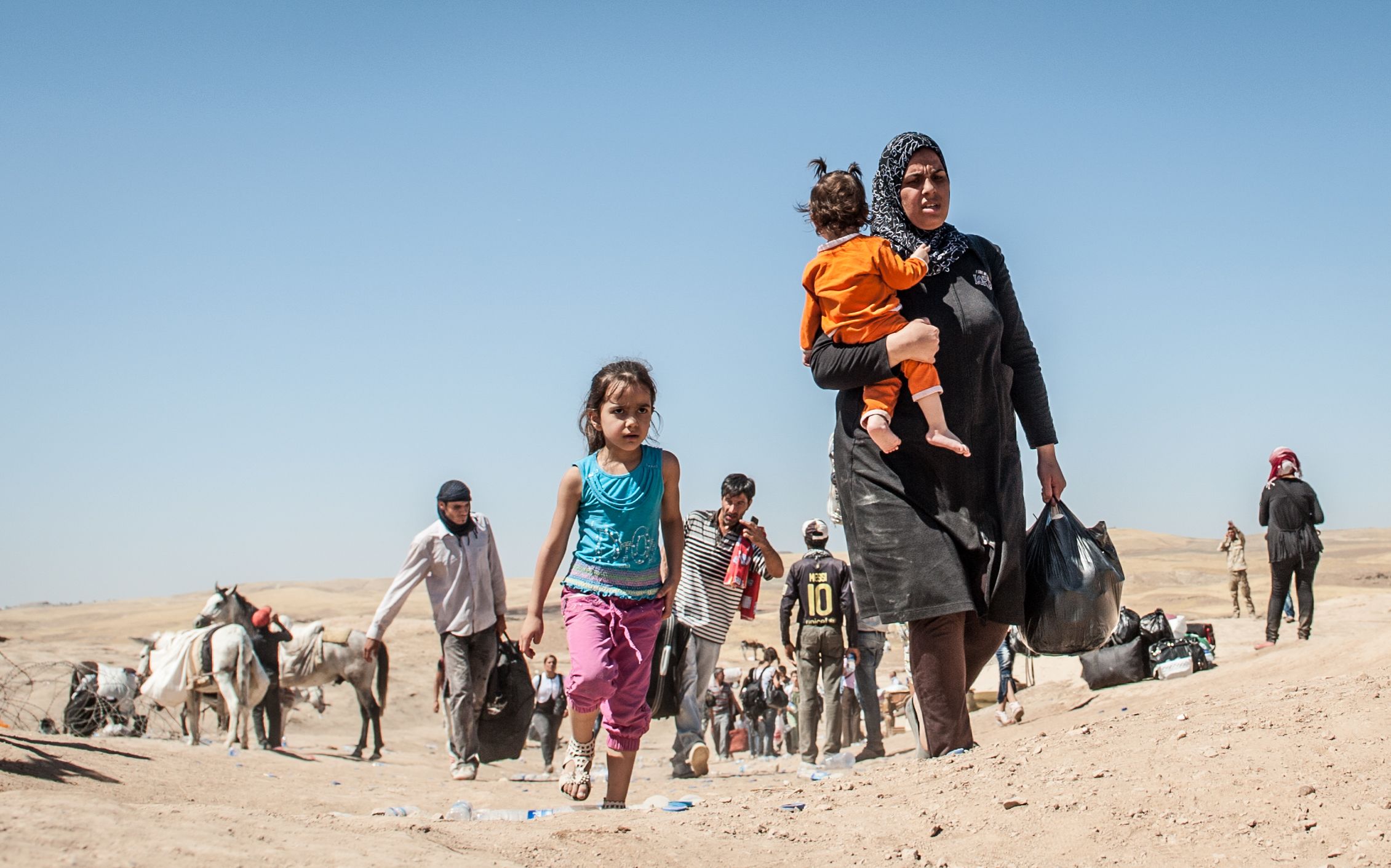 Refugees crossing the Sahela border between Syria and the Kurdistan region of Iraq in 2013.
